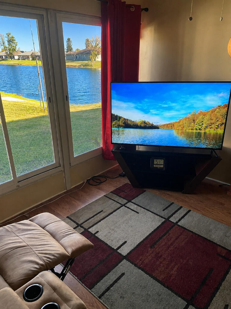Beautifully remodeled and spacious 3-bedroom, 2-bath CBS home with premium lake views located in the desirable Spanish Lakes Fairways community in Fort Pierce. This move-in-ready home offers exceptional value with major updates already completed and one of the lowest lakeview land leases in the community at only $633.54/month.  The bright and open interior features fresh interior and exterior paint, new kitchen cabinetry, granite countertops, stainless steel appliances, updated lighting, beautiful new flooring, and abundant closet/storage space throughout. The split bedroom floor plan also includes multiple living areas with relaxing lake views from the TV/Den room, primary bedroom, and gym/flex room. Major upgrades include a full-house repipe completed in 2025, A/C replaced in 2019, hot water heater replaced in 2020, Smart stainless steel refrigerator replaced in 2025, and garage door assembly/mechanism replaced in 2025, security cameras, storm shutters, keyless entry on entry and garage doors.  Additional features include a spacious 2-car garage, 2-car driveway parking, CBS construction, and the option to purchase furnished or unfurnished. Ideal for retirees, snowbirds, investors, or buyers looking for a spacious Florida home with significant upgrades already completed.  Meet friends and enjoy the Community which offers, Free Golf, Tennis, 2 pools, Library, Full Gym, Bingo, Bocce ball, and so much more.........   Flexible closing timeline available. Cash buyers only, roof needs replacement. LIST PRICE: $199,999.00
