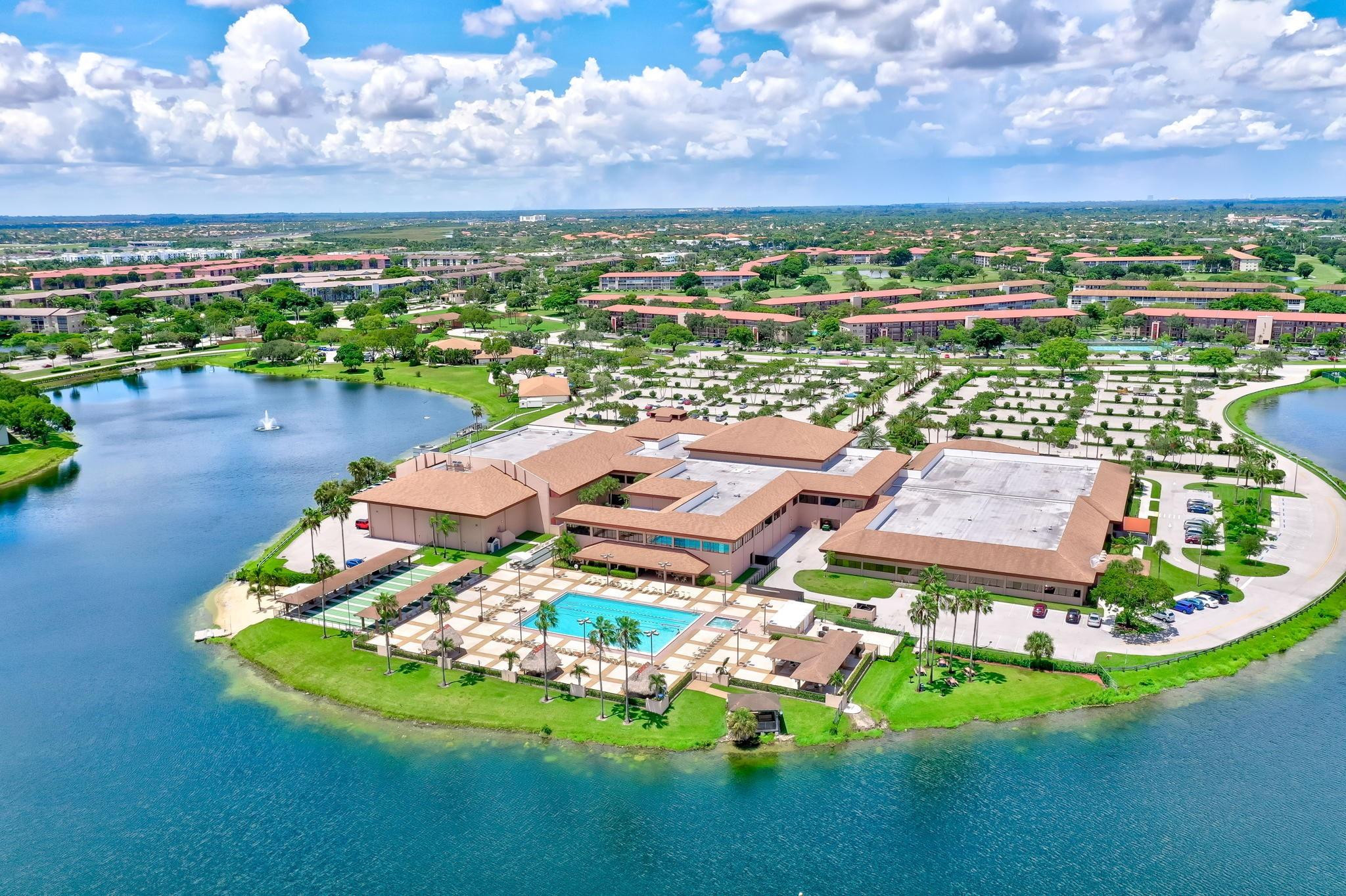 NEWEST SECTION AND THE BEST BUILDING IN THE ENTIRE COMMUNITY !!! "HIBISCUS MODEL" ; BRIGHT  1 BEDROOM; 1.5 BATHROOMS CONDO ON THE 3RD FLOOR;  PRIVATE BALCONY ; WASHER AND DRYER; WALKING DISTANCE FROM THE FITNESS CENTER; SERENE  LAKE VIEW; LAMINATED FLOORS. 55+ COMMUNITY OFFERING EXCELLENT AMENITIES. PRIME LOCATION NEAR UPSCALE SHOPPING & DINING.  CONFORTABLE LIVING AT ITS BEST!
