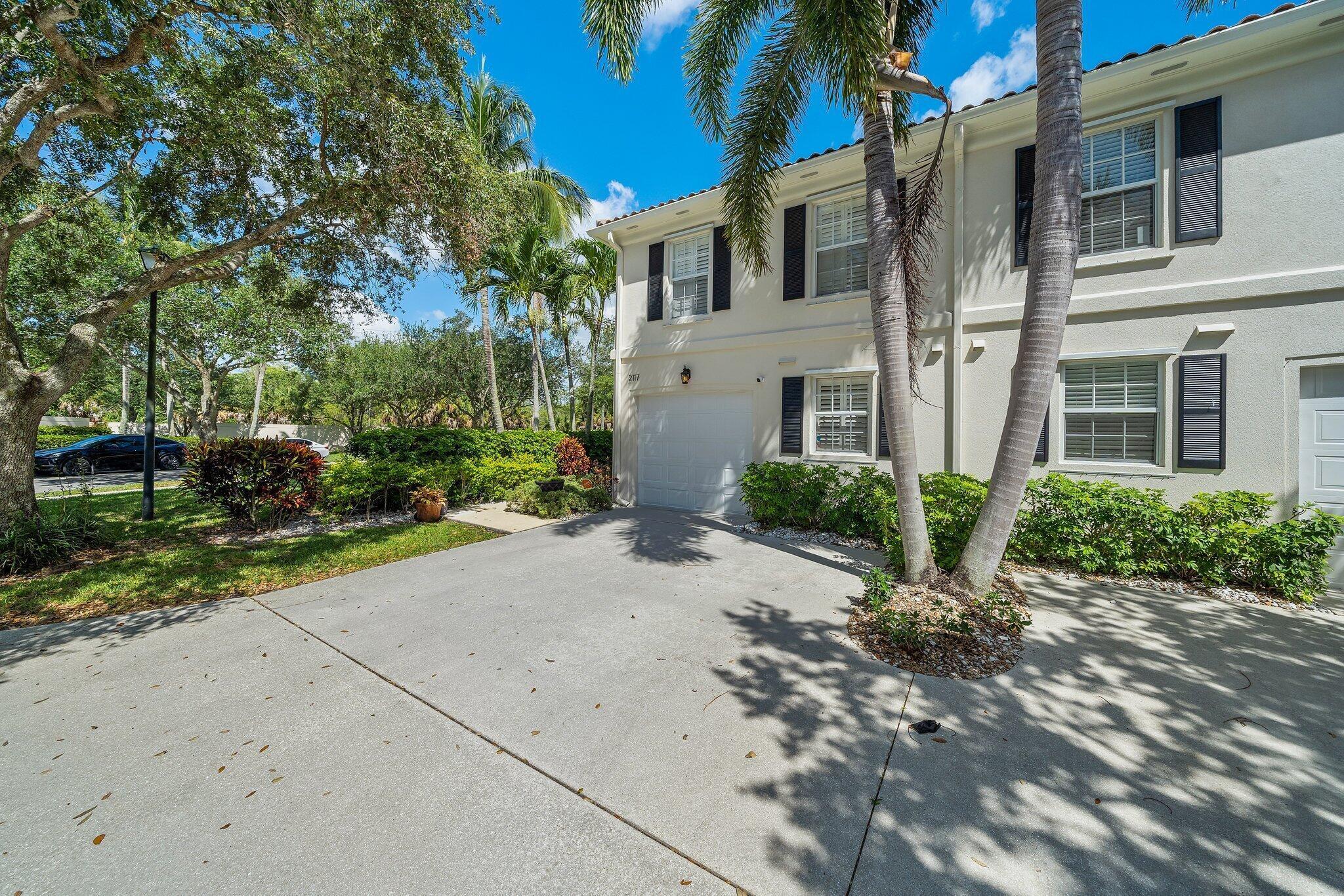 Excellent opportunity to lease this updated corner-unit townhome, ideally situated on a quiet street in the desirable Riverwalk community. The property features a beautiful galley kitchen equipped with premium granite countertops and top-of-the-line smart appliances. An oversized, screened-in patio provides the perfect space for outdoor dining and entertaining. The interior is exceptionally clean, boasting ceramic tile and wood flooring throughout. The spacious primary suite includes a luxurious bathroom complete with dual sinks, a deep soaking tub, and a separate step-in shower.