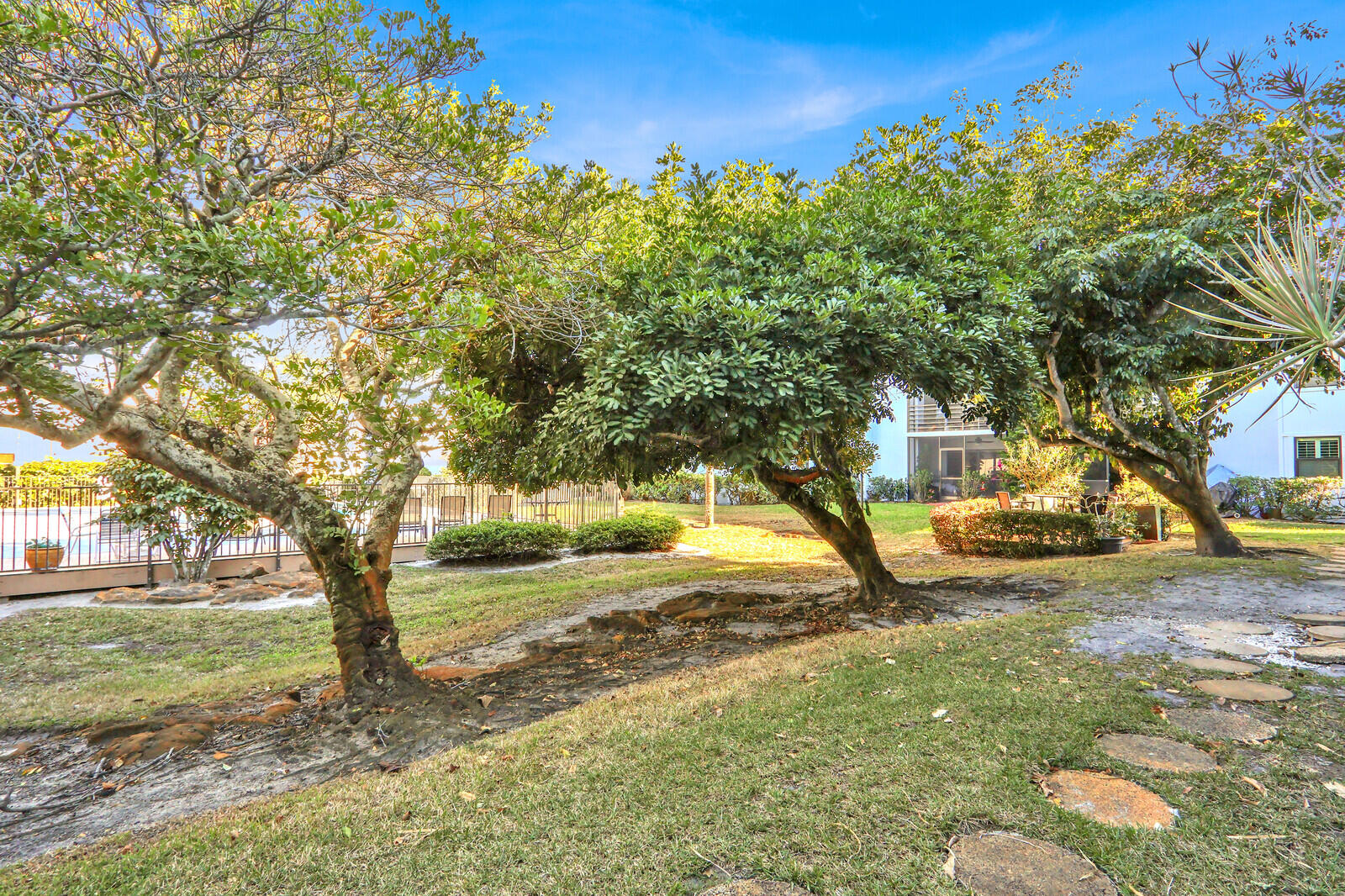 Welcome to this beautifully maintained first-floor unit, offering a desirable split-bedroom floor plan that provides both privacy and effortless flow. Bathed in natural light, this unit feels bright and welcoming throughout. Some major updates that will bring peace of mind include a newer roof and a recently updated air conditioning system (2022), fresh paint, stainless appliances, light fixtures and all new  flooring throughout allowing you to move right in and enjoy. The association enhances the lock-and-leave lifestyle by covering water, cable, exterior insurance, and trash services, covered parking and a community pool. Rental restrictions for the first two years help preserve the community's residential feel, making this an excellent option for primary living or a future investment.