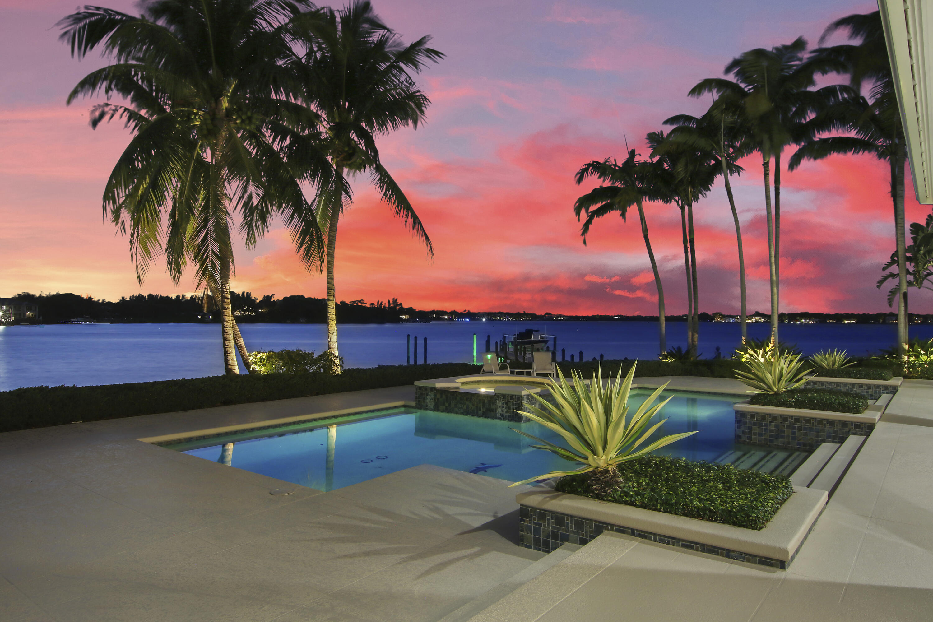 Enjoy views of one of the widest sections of the beautiful Loxahatchee River with swaying palm trees, abundant wildlife and a paradise sunset every evening in this custom Neandross home nestled on a quiet street in Tequesta Country Club.

Perfect lot positioning on the oversized lot and a half creates breath taking views from every angle.  The covered patio overlooks the custom pool and spa onto 150'+ of deep water frontage with direct ocean access.  

The easy-living one story floor plan has been professionally designed and has high ceilings that make every room feel open and spacious.    Large picture windows highlight the river views and let in natural light throughout.

Please see the ''more section'' for additional details It's never a chore to work in the high-end kitchen that is open and spacious with river views at every turn.  Kitchen features include built-in refrigerator with wood panels, granite counters, custom cabinet built-ins and a wet bar with prep sink in the breakfast area.  The large center island and tall cabinets give ample storage and counter space which creates the perfect chef's triangle.

The master bedroom has panoramic river views and is extremely spacious with custom mahogany built-ins.  The master suite is separated from the rest of the bedrooms giving everyone their own space.  The master bathroom has marble counters, an oversized shower and marble flooring.  The home office features custom mahogany built-ins and mahogany flooring and could be converted to a fifth bedroom, if needed. Flooring through the main living areas is a beautiful, low maintenance travertine.  

The seawall was replaced and elevated in 2010.  The dock was redone with low maintenance lumber rock and new elevated pilings 12/2017 and boasts two moorings for multiple boats (one large boat) or other water toys for the ultimate Palm Beach lifestyle.  The deep water dock has one of the furthest reaches in the area and extends to approximately 108' which along with the snook light, makes it a special fishing spot.  The boat lift was replaced in 2013 with a 20' Hi-Tide aluminum catwalk and is rated for a boat up to 6000 pounds and has a remote for easy usage.

The barrel tile roof, gutters and whole house lightning detectors were replaced in 2016, water heater replaced in 2018 and the HVAC units were replaced in 2018.  All updates have been done top of the line - including a commercial grade Ubiquiti UniFy wifi network, smart home garage door opening automation and whole house audio.  This home is immaculate and move-in ready.  You will not find better views or a better maintained home in tony Tequesta!