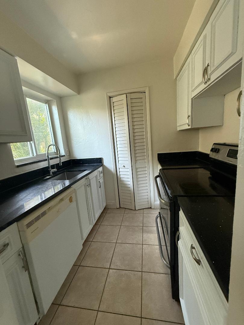 Welcome to this charming one-bedroom, one-bathroom ground floor corner apartment located in a boutique building in the Pinehurst community of Pompano Beach, Florida. The thoughtful layout maximizes the available square footage to create functional areas for comfortable everyday living. This unit has tile floors and an updated kitchen and bath! Steps to Publix, shops, restaurants, and the beach!  Great location!
