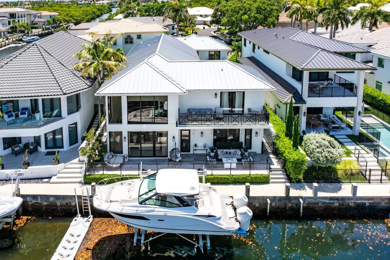 Turn-Key Waterfront Luxury in Exclusive Boca Marina. Experience the ultimate in Florida living with this fully renovated waterfront paradise, perfectly located in Boca Marina, one of only two gated waterfront communities in all of Boca Raton.

Step through your private courtyard into a resort-style haven complete with a heated saltwater pool, a fully equipped outdoor summer kitchen, and a separate guest house featuring a full bath and mini-fridge, ideal for hosting friends and family.

Inside the main residence, luxury abounds:
* 5 spacious bedrooms
* 5 full and 1 half baths
* Private home office
* Dedicated movie theater

Floor-to-ceiling windows frame sweeping water views, while soaring ceilings and open living spaces create a light-filled, welcoming ambiance. The elegant entertainment barwith built-in wine cooler and ice makeris perfect for gatherings.

The home also boasts hurricane-rated impact glass and a full-house generator for added security and comfort.

Community Perks:Enjoy unmatched amenities including a community pool, pickleball courts, dog park and a children's playgroundall within this coveted gated enclave.

Prime Location:Ideally positioned between Downtown Boca Raton and the vibrant dining, shopping, and entertainment of Delray Beach's Atlantic Avenue.

This rare turn-key opportunity comes move-in ready, with furniture and boat negotiableallowing you to step into the complete Florida lifestyle from day one.