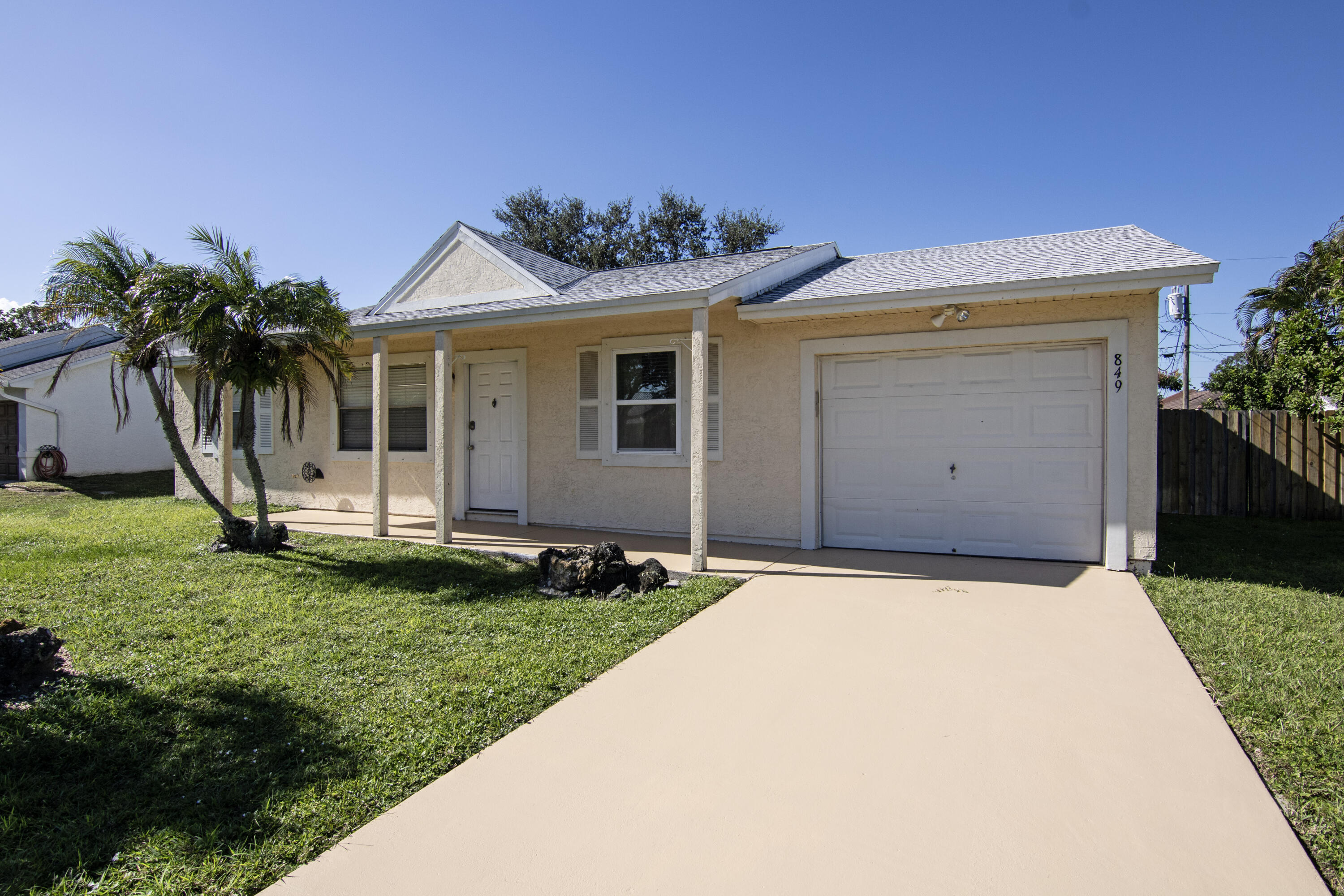The cutest 2-BD, 2-BA, Home-Office & Pool Home with No HOA!!  What a great opportunity for an investor or first-time buyers. Located in a prime location it offers: 2-BD 2-BA 1-Car Garage (Converted into a Home Office+Storage), freshly painted inside, Brand New Carpet in Master Bed & Home Office, New Roof in 2023, New AC in 2021, New Water Heater 2025 & New Pool patio screens in 2025. Inside it offers, Cathedral Ceilings, Upgraded Master Bathroom, Lots of Natural lights, Newer Washer and Dryer. Besides that, it has a huge Fenced backyard with plenty space, green house, boat, RV and of course, your best friends (your pets). Convenient to i-95, FL Turnpike and all restaurants, hospital, Tradition Shopping center, Saint Lucie West & Gatlin area. Welcome to the Florida lifestyle!!