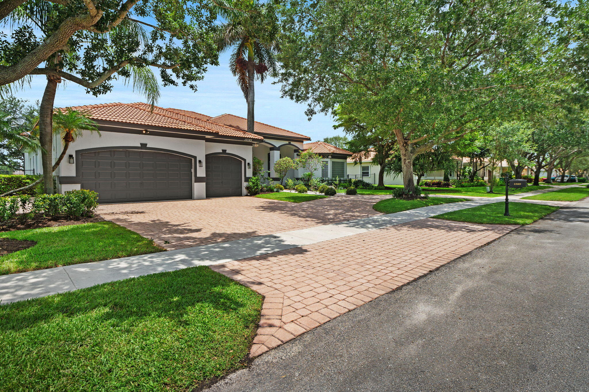 Fully renovated and professionally designed lakefront 6BR/4BA home in a private gated community in Davie, offering modern luxury and resort-style living.  Bright open layout with 14-ft ceilings, abundant natural light, and sleek Italian porcelain flooring. Chef's kitchen features custom cabinetry, high-end appliances, spacious pantry, and generous counter space.  Primary suite with hardwood floors, dual custom walk-in closets, and spa-style bath with double rain showers.  Enjoy seamless indoor-outdoor living with a renovated saltwater pool, new marble deck, lake views, and a fully equipped outdoor kitchen.  Bonus room ideal for office/gym + renovated epoxy-finished garage.  Move-in ready with high-end finishes in one of Davie's most desirable gated
