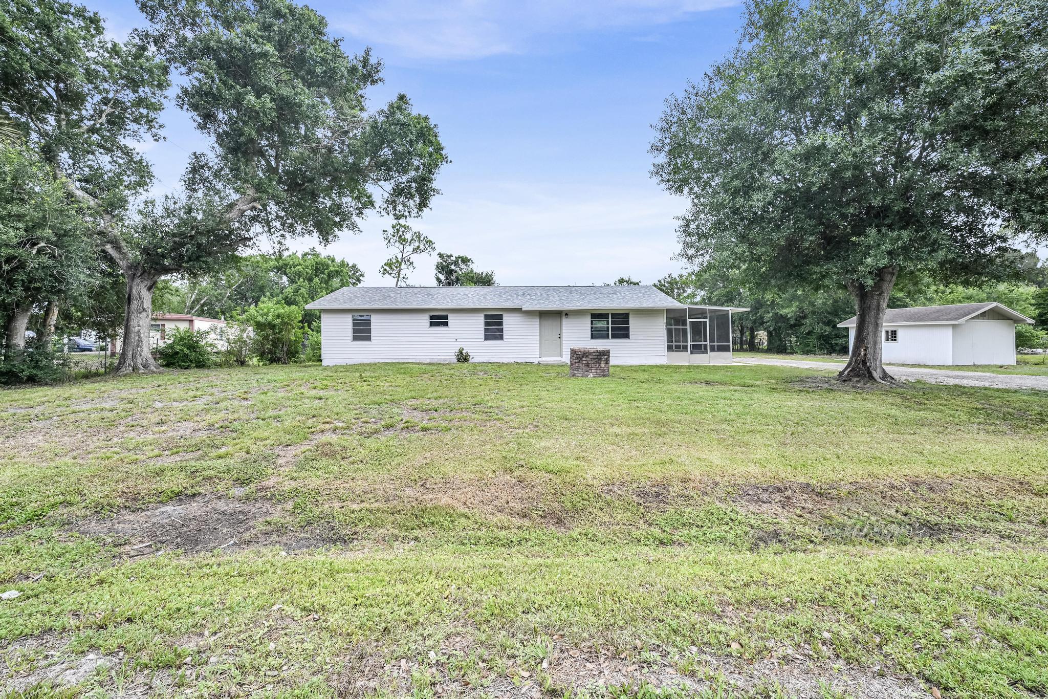 Welcome to this beautifully remodeled home situated on a spacious over half-acre lot in the heart of Okeechobee! Conveniently located just minutes from downtown shopping, dining, schools, and local amenities, this property offers the perfect blend of space, comfort, and convenience.Recent upgrades include a brand-new roof, luxury vinyl plank (LVP) flooring throughout, beautifully remodeled bathrooms, fresh interior and exterior paint, and updated baseboards that give the home a clean, modern feel. The expansive lot provides plenty of room for boats, RVs, recreational vehicles, gardening, or future additions, with endless possibilities to make the property your own. Whether you're looking for a primary residence, seasonal retreat, or investment opportunity, this home is ready for you!