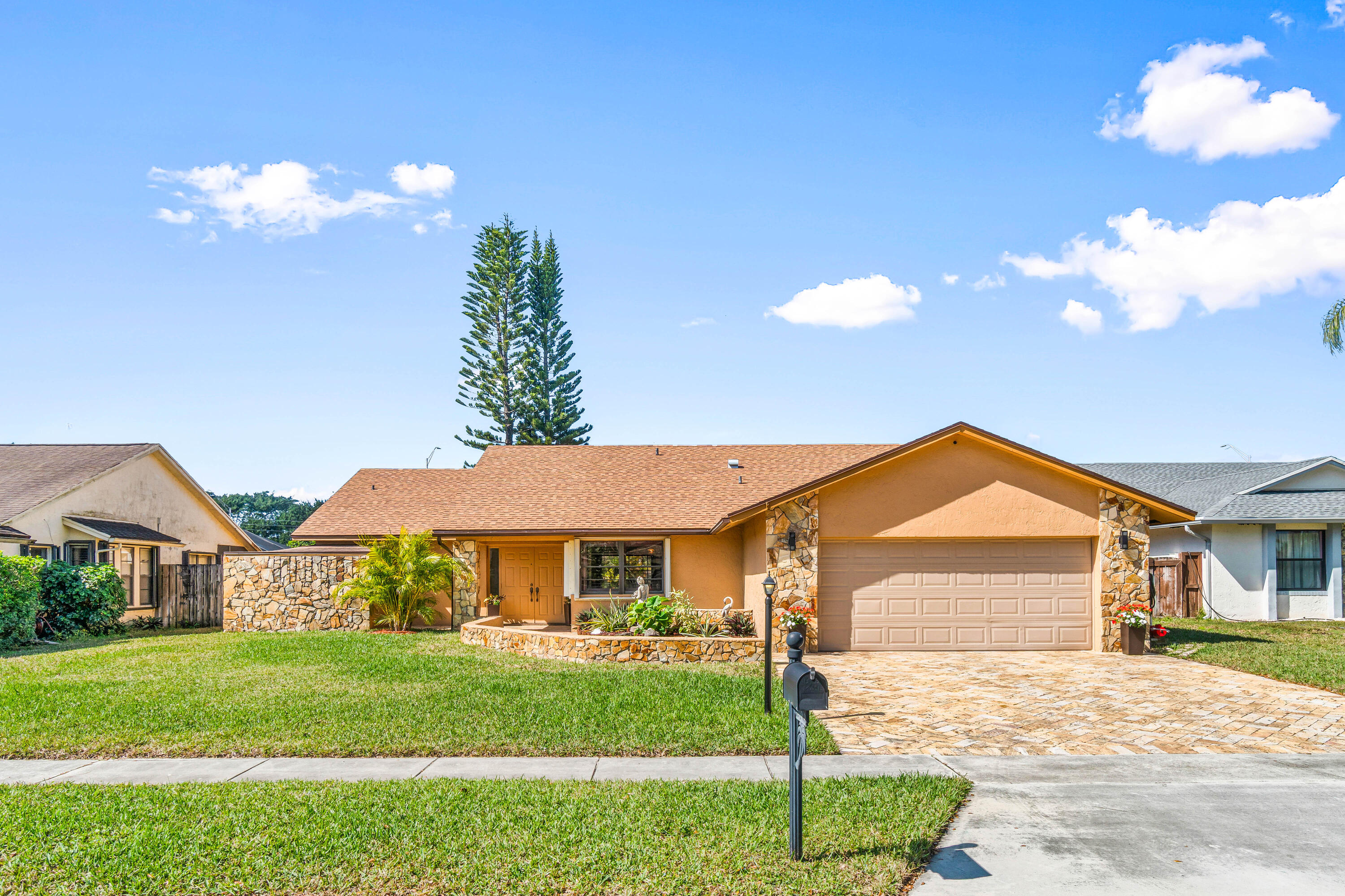 Absolutely stunning 3BR/2BA pool home on an oversized 10,000+ SF fully fenced lot in the highly desirable Estate Section of Boca Fontana! Situated by a quiet cul-de-sac with minimal traffic and A-rated schools, this move-in ready home offers the perfect blend of privacy, space, and style. The backyard is a true showpiece featuring a breathtaking updated freeform pool surrounded by gorgeous travertine marble decking and expansive patio space ideal for entertaining. Inside, enjoy volume ceilings, an open-concept split floor plan, and a beautifully upgraded granite kitchen with stainless steel appliances and center island. The oversized primary suite features a walk-in closet and renovated bath. New Roof 2025. accordion shutters, hurricane-rated garage door. HOA $205 cable tv, 2 heated pools.