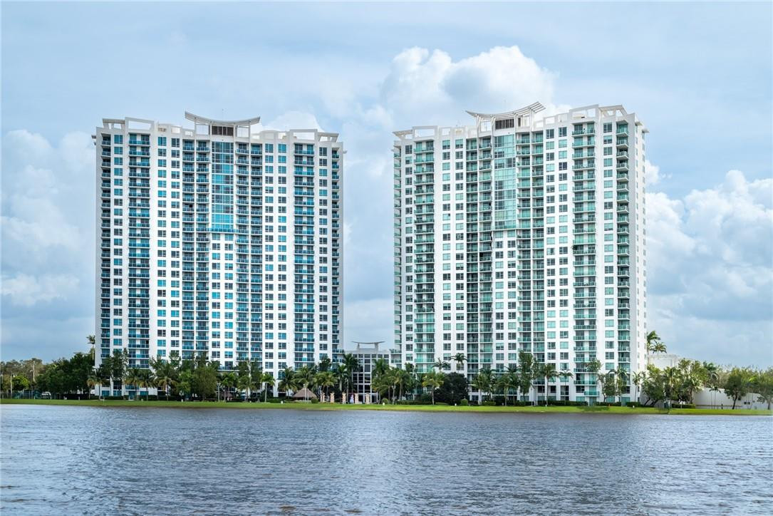 Set against a lakefront backdrop where you can enjoy serene unobstructed views of the everglades from the main balcony. Located in Tao Sawgrass with resort style amenities and walking distance to internationally known Sawgrass Mills Mall, this updated lakefront condo is the perfect place to call home or purchase as an investment (rentals are permitted up to 12x per year for a minimum of 30 days). Kitchen and bathrooms have recently been remodeled and this floor plan includes a den that can be converted to a third bedroom. Three gated entrances to conveniently access the parking garage. 24 hour roaming security.