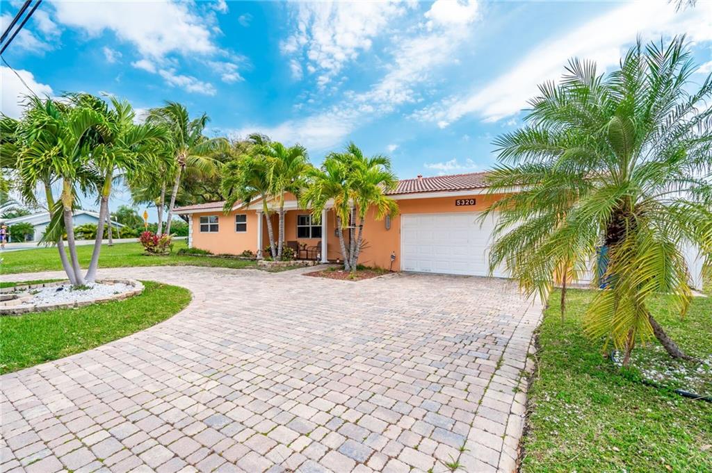 Wow factor, this Lovely Landings area home offering  a T canal, Open Water views from the Wall of Glass Doors . A MUST SEE FOR ENTERTAINING. LOVELY HIGHLY POLISHED BAR IN LIV AREA.  Plantation shutters! Huge living room/dining area. New Open modern kitchen built for a chef. Large Master Bedroom has cabana bath out to the pool  Located on Large corner lot.  Very well maintained spacious pool home with a lot of updating is waiting for you.  2 Car Garage, 5 minutes to Intra Waterway w/ one 11.5 ft. Bridge. Owner will include the 26' twin Yamaha Sundeck boat negotiable with the offering.Furn a possibility too.