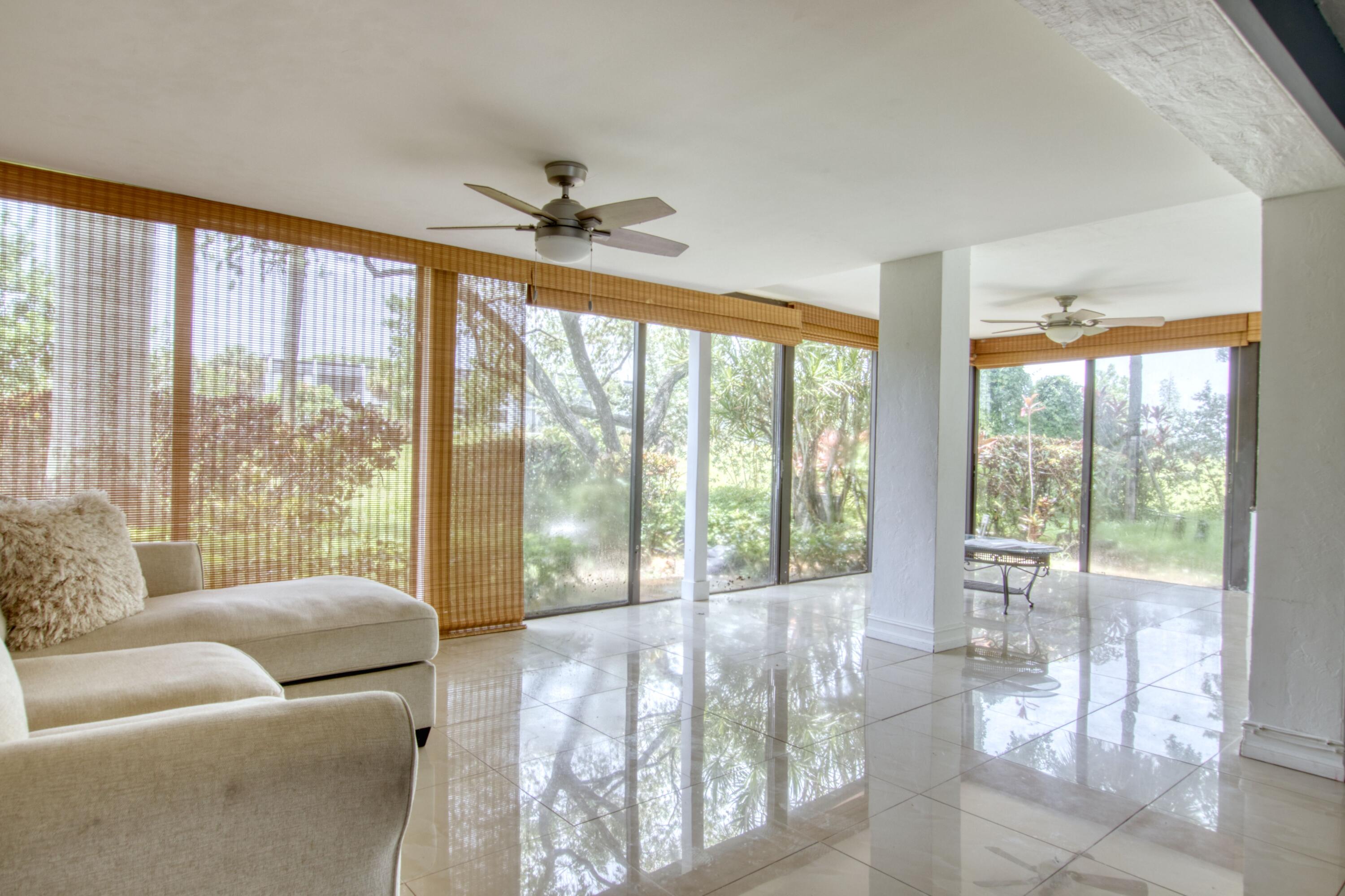 Unique 3/3.5 townhome.  Each bedroom has full private bath.  Master Suite on 1st. floor.  Enjoy washer/dryer, walk in closet, open kitchen, large, glass Florida room, accordion storm shutters & large tiles throughout.  Experience the tranquility of & manned guard gates & 24-hour security patrols all located on lush tropical grounds.  This amazing location is minutes from the Florida Turnpike, I 95, great shopping, entertainment & activities, airports, medical centers, places of worship & all the beaches.