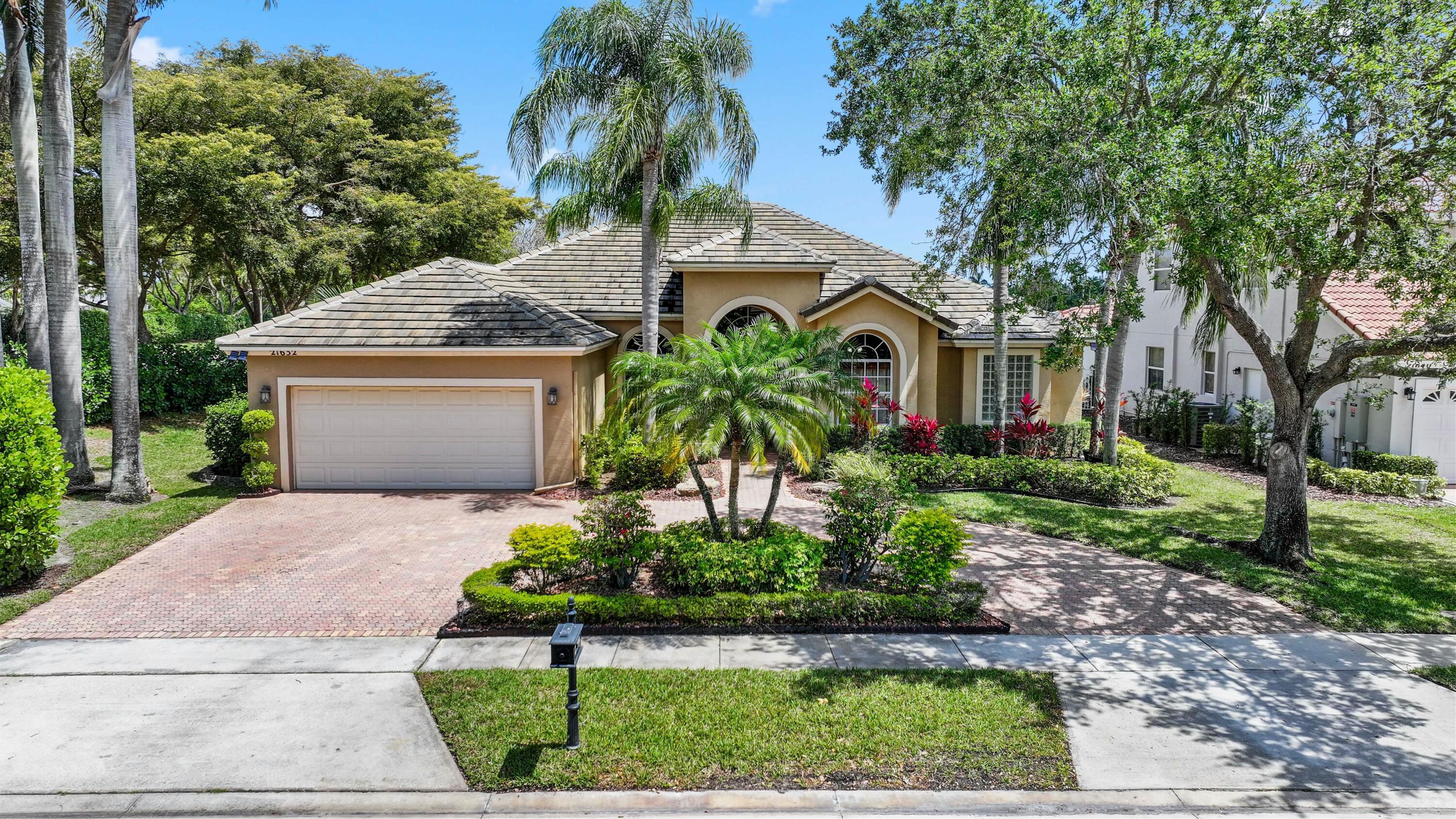 Situated on an oversized corner lot in Boca Falls, this four bedroom, three bathroom lakefront residence offers 2,731 square feet of well-designed living space. A new roof was completed in 2022, and the home features marble flooring in the main areas and wood flooring in the bedrooms. The kitchen includes granite countertops, wood cabinetry, and opens to a spacious family room. A split bedroom layout provides privacy. The screened patio overlooks long lake views and includes a pool, and outdoor space. Boca Falls residents have access to a renovated clubhouse with an Olympic size pool, fitness center, tennis courts. Waters Edge Elementary, Loggers Run Community Middle, West Boca High School. Call Agent for more information and private showings.