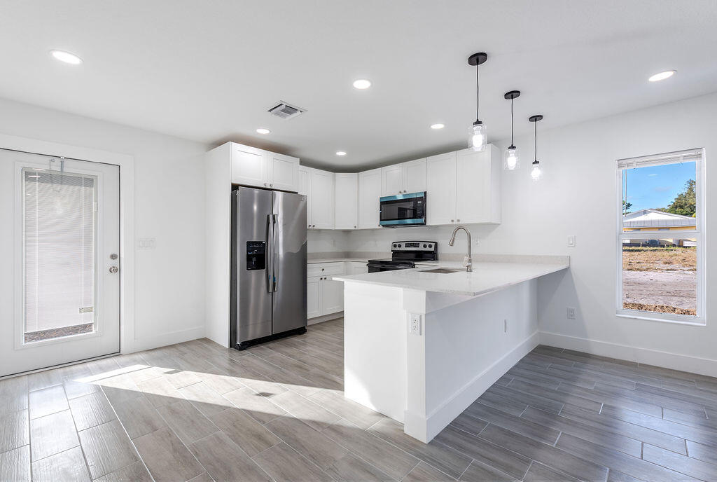 Welcome to this beautiful new construction home featuring 3 bedrooms and 2 full bathrooms. Enjoy the modernity and quality of the stainless steel appliances in a dream kitchen, while the impact windows and doors ensure safety during hurricane season. Located in a quiet neighborhood, you'll be close to supermarkets, restaurants, gyms, stores, and just minutes from the beach. Everything you need, within reach! Pictures belongs to the model House