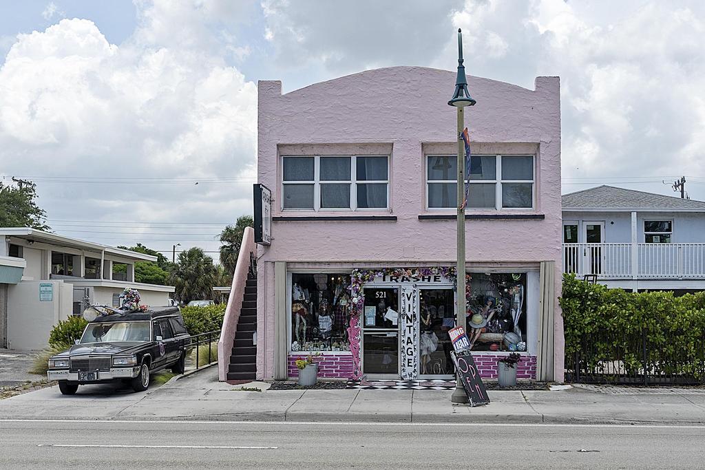 Spacious 2 bedroom 2 bath apartment in the center of Lake Worth Beach. Second floor in a vintage building with hardwood floors, high ceilings, central air, in unit washer/ dryer, impact windows and off street parking. Perfect for a home office or to share with a roommate. Available July 15th.