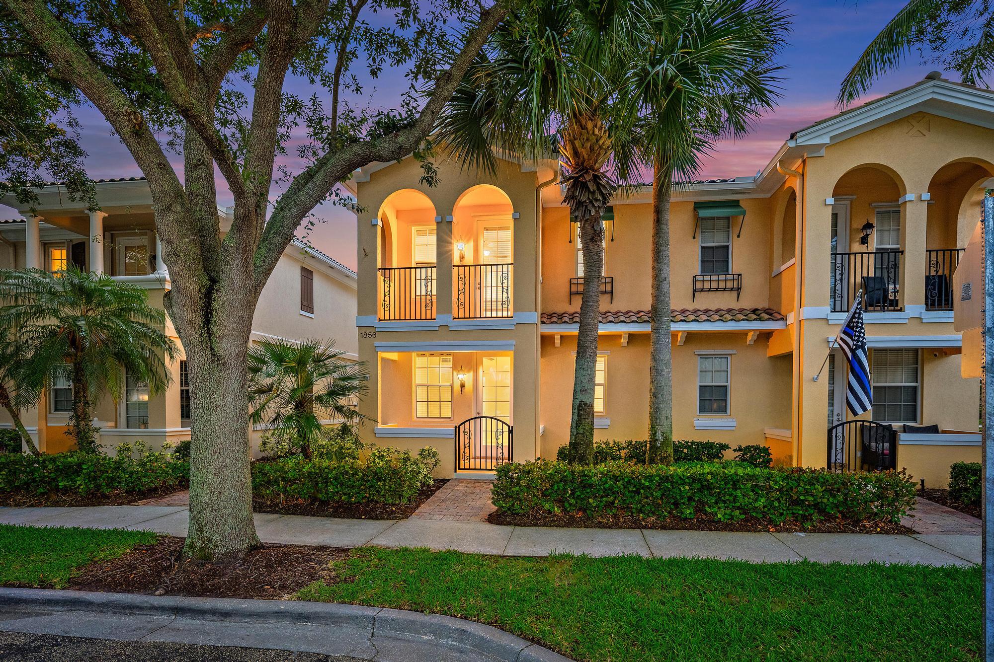 Welcome to Tuscany at Abacoa, where modern style, comfort, and the best of the Florida lifestyle come together in one exceptional residence. Perfectly positioned across from an expansive community green space, this beautifully maintained townhome offers more than 1,800 square feet of thoughtfully designed living space. Featuring four bedrooms, three full bathrooms, and a detached two-car garage, the highly desirable floor plan includes a first-floor bedroom and full bath—ideal for guests, a home office, or multigenerational living. Surrounded by lush landscaping and abundant natural light, this residence combines everyday functionality with the relaxed elegance that makes Abacoa one of Jupiter's most sought-after communities. Inside, you'll find wood-look porcelain tile flooring throughout and an abundance of natural light that enhances the home's open and inviting atmosphere. The stylish kitchen is designed for both everyday living and entertaining, featuring crisp white cabinetry, quartz counters a designer tile backsplash, and generous storage space. The kitchen flows seamlessly into the spacious living area, where triple sliding glass doors open to a private screened patio, creating the perfect indoor-outdoor setting for relaxing or hosting family and friends.  Upstairs, the primary suite offers a peaceful retreat with a custom walk-in closet complete with built-in organization and a spa-inspired bathroom featuring dual vanities, a soaking tub, and a glass-enclosed shower. A private balcony off the primary suite provides the perfect place to enjoy your morning coffee or unwind at the end of the day. Two additional guest bedrooms and bathroom complete the second level. Recent updates include a new hot water heater and a new dryer, both installed within the past year.  Residents of Tuscany at Abacoa enjoy access to outstanding amenities, including a resort-style swimming pool, fitness center, clubhouse, basketball court, playground, community room, sidewalks, and beautifully maintained common areas.  Ideally located within walking and biking distance to Abacoa's vibrant town center, you'll enjoy easy access to popular restaurants, shopping, parks, and entertainment. Jupiter's pristine beaches, championship golf courses, and the renowned Spring Training facilities for the St. Louis Cardinals and Miami Marlins are all just minutes away. Combining an exceptional location, thoughtful upgrades, and a desirable floor plan, this residence offers an outstanding opportunity to experience the very best of Abacoa living. Schedule your private showing today.
