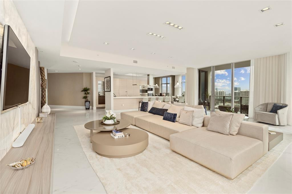 EXTREMELY RARE OPPORTUNITY TO OWN THE SOUTHEAST CORNER DOUBLE UNIT PENTHOUSE IN THE 5-STAR LUXURY YACHT CLUB-THE MARINA PALMS!! CREATED BY STEVEN G. DESIGN, THIS INCREDIBLE MANSION IN THE SKY FEATURES EVERY CONCEIVABLE LUXURY, SERVICE, APPOINTMENT, DETAIL & AMENITY THAT ONE COULD EVER DESIRE!! FINISHED USING THE HIGHEST QUALITY MATERIALS & CRAFTSMANSHIP, THIS MASTERPIECE ALSO LOOKS NEVER LIVED IN! THE (4) PREMIUM MAIN FLOOR, SIDE BY SIDE PARKING SPOTS W/PRIVATE TESLA CHARGER & AVAILABLE 85' PRIME BOAT SLIP OFFER THE QUINTESSENTIAL SOUTH FLORIDA LIFESTYLE IN UPSCALE AVENTURA! STUNNING PANORAMIC VIEWS FROM FLOOR TO CEILING WRAPAROUND GLASS, DOUBLE OVERSIZE BALCONIES, CHEFS KITCHEN, THEATER, & ENTIRE WALL OF BACKLIT ONYX FORGE THE ULTIMATE ENTERTAINING VENUE! MUST SEE!!!