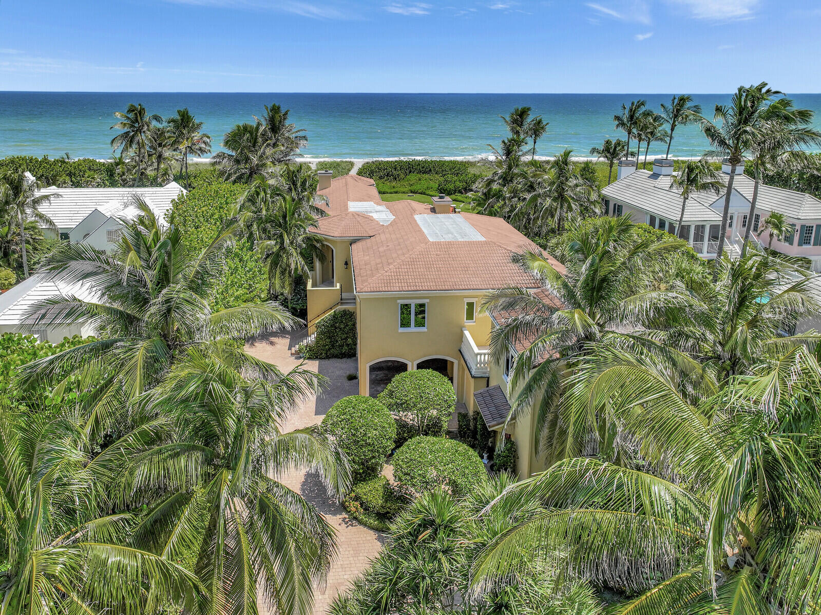 Welcome to your secluded paradise on the prestigous JUPITER ISLAND! This 5 bedroom, 4 !/2 bath, OCEAN FRONT home offers the pinnacle of luxury living! Nestled amidst lush landscaping, this retreat guarantees the utmost privacy. Safety and resillience are of papamount importance, which is why this home features impact windows that provide both protection and energy efficiency. The seperate guest house features  1 bedroom, 1 bath and a kitchenette providing a private haven for guests. Step outside to your personal oasis :a pool with sparkiling waters that mirror the nearby ocean, an outdoor shower to rinse off after a refreshing swim. Elegance abounds in the details of this home. The kitchen boasts  granite counter tops, plantation shutters add a touch of southern charm!