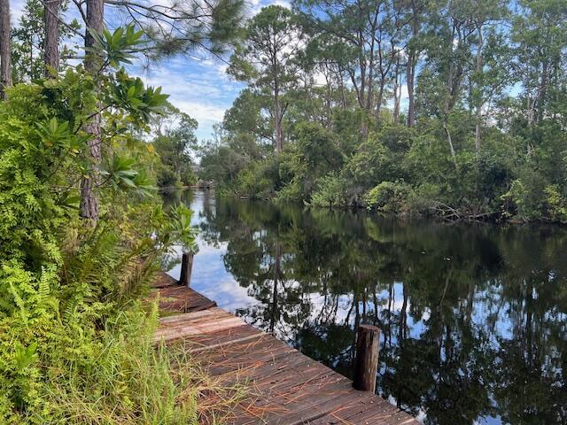 Amazing property in Leisure Lakes on the canal with fixed dock! .25 acres [adjoining lot  -1135-for sale as well!] Partially cleared, driveway, perfect to build your dream home or get-a-way and have access to all your favorite water sports right at your back door! Direct access to Lake Carrie and to Lake June!

All measurements are approximate