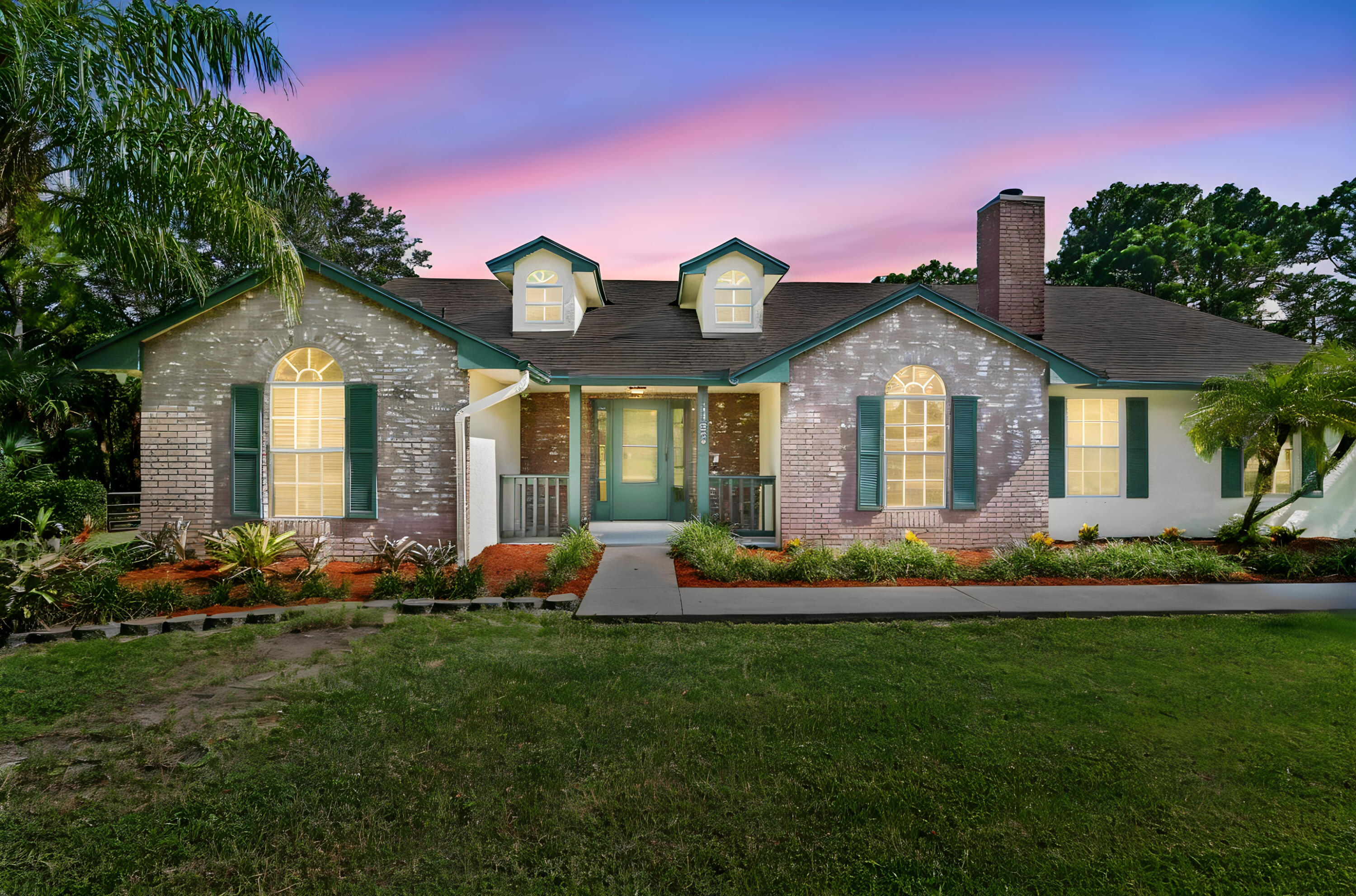 Welcome to this charming 4-bedroom, 2-bathroom pool home nestled in The Acreage, FL, situated on a sprawling oversized 1.37-acre lot with no HOA, a NEW ROOF, fresh exterior paint and located on a paved road. This single-story home offers 1,740 square feet of finished living space, with a beautifully updated kitchen, updated bathrooms, updated flooring, gas burning fire place, features the unique advantage of waterfront canal & pond property, providing a peaceful and scenic setting and a large pole barn for boat or RV parking.  The property also includes an attached 2-car garage along with a driveway that offers additional parking space for guests, recreational vehicles, or extra cars.  Combining practical design, generous outdoor space, and the freedom of no HOA restrictions, this home presents an exceptional opportunity to enjoy the distinctive lifestyle and natural beauty of The Acreage community.