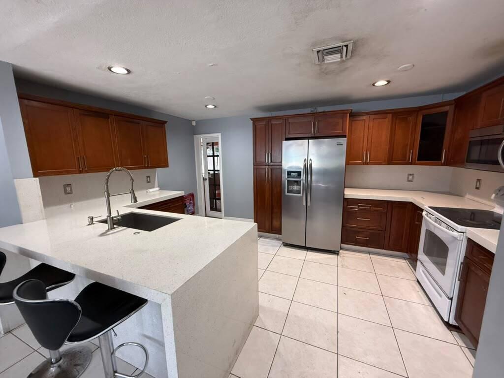 Great Investment Income Opportunity! Excellent opportunity for investors or owner-occupants looking to generate rental income. According to county records, this property is a 2-bedroom, 2-bathroom home. It is currently configured with: A main unit featuring 2 bedrooms and 1 bathroom, which is vacant and ready for an owner-occupant or a new tenant. A studio unit with 1 bedroom and 1 bathroom, currently rented on a month-to-month basis. An efficiency unit, also rented on a month-to-month basis. Whether you're looking to live in the main unit while collecting rental income or maximize cash flow by leasing all units, this property offers excellent income-producing potential. Property is being sold AS IS.