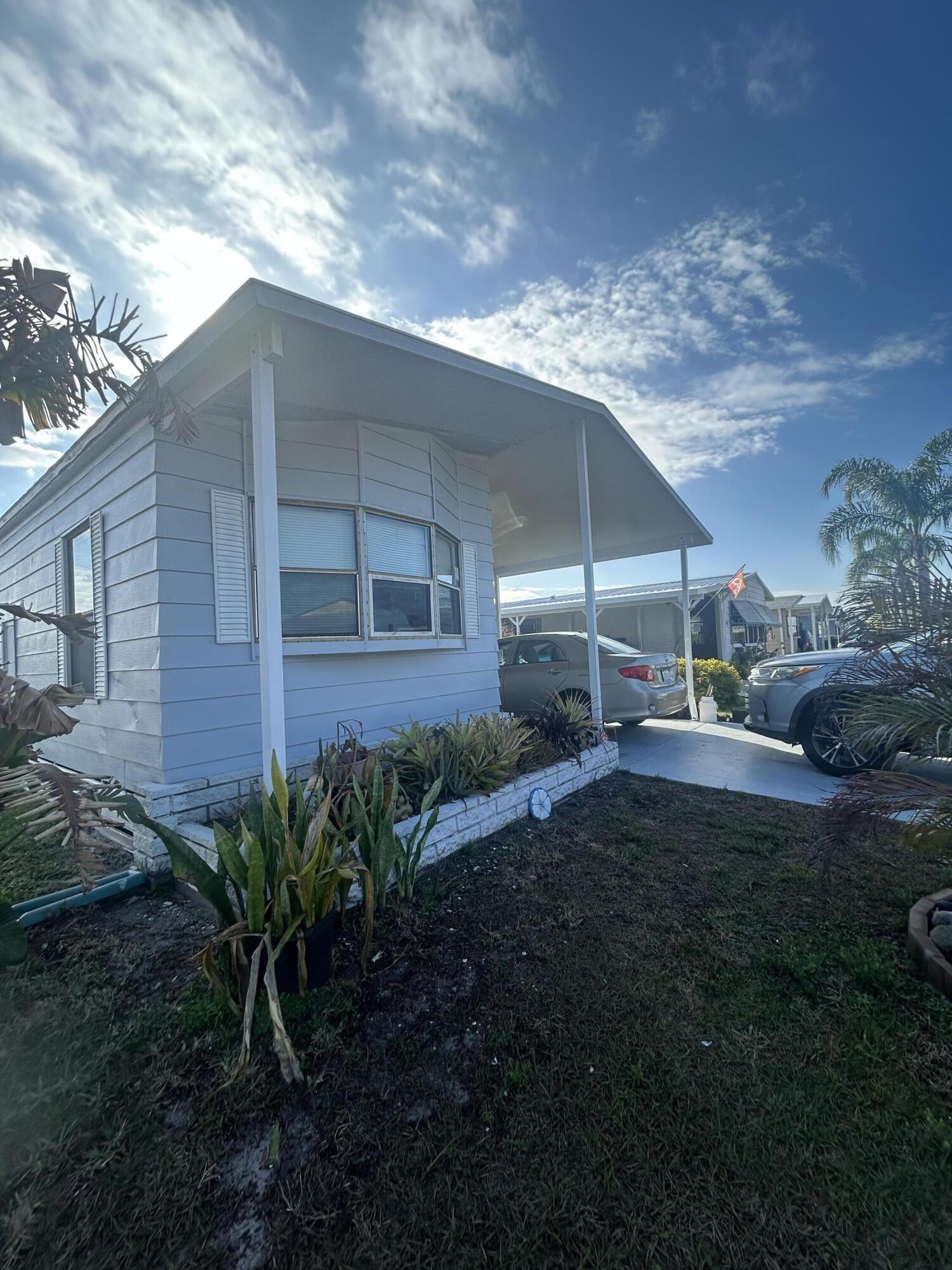 This manufactured home is in a 55 plus community, it's located in Spanish Lakes Country Club, it has New Appliances New Flooring Throughout House, Freshly Painted Inside & Outside, Fully Furnished, New Roof, new carpet, air condition is only two years old duck work newly done, screened in patio. and much more, buyers have to be park approved