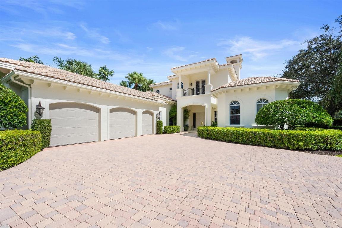 Welcome to 115 Echo Lane, a masterfully reimagined residence that captures the essence of luxury golf course living within The Loxahatchee Club, one of Palm Beach County's most coveted gated communities. Perfectly positioned along the 15th hole of the Jack Nicklaus Signature Course, this elegant home offers 120 feet of sweeping golf frontage framed by lush landscaping.  Inside, modern sophistication meets timeless design. Herringbone-patterned hardwood floors flow through gracious living spaces, while the completely renovated kitchen showcases Macchia Vecchia marble countertops and backsplash, a Sub-Zero refrigerator and freezer, custom hood, and Kohler sinks and hardware.  Freshly painted cabinetry, designer lighting, and select upgraded window treatments add a refined finishing touch throughout.  The powder and cabana baths feature Macchia Vecchia marble countertops and designer wallpaper, seamlessly continuing the home's elevated aesthetic. The primary suite, guest suite, and office are conveniently located on the main level, with two additional guest suites and a versatile loft upstairs. Additional enhancements include new carpeting in the primary and guest suites, all-new lighting and sconces throughout, and complete interior and exterior repainting in 2024.  Technology and comfort updates include a new Hotwire alarm system with doorbell camera and a fully digital pool and spa system. Outdoor improvements feature landscape lighting, refreshed grounds with new sod, and the addition of lemon and mango trees.  115 Echo Lane blends thoughtful design, modern comfort, and timeless style in one exceptional Loxahatchee Club residence.