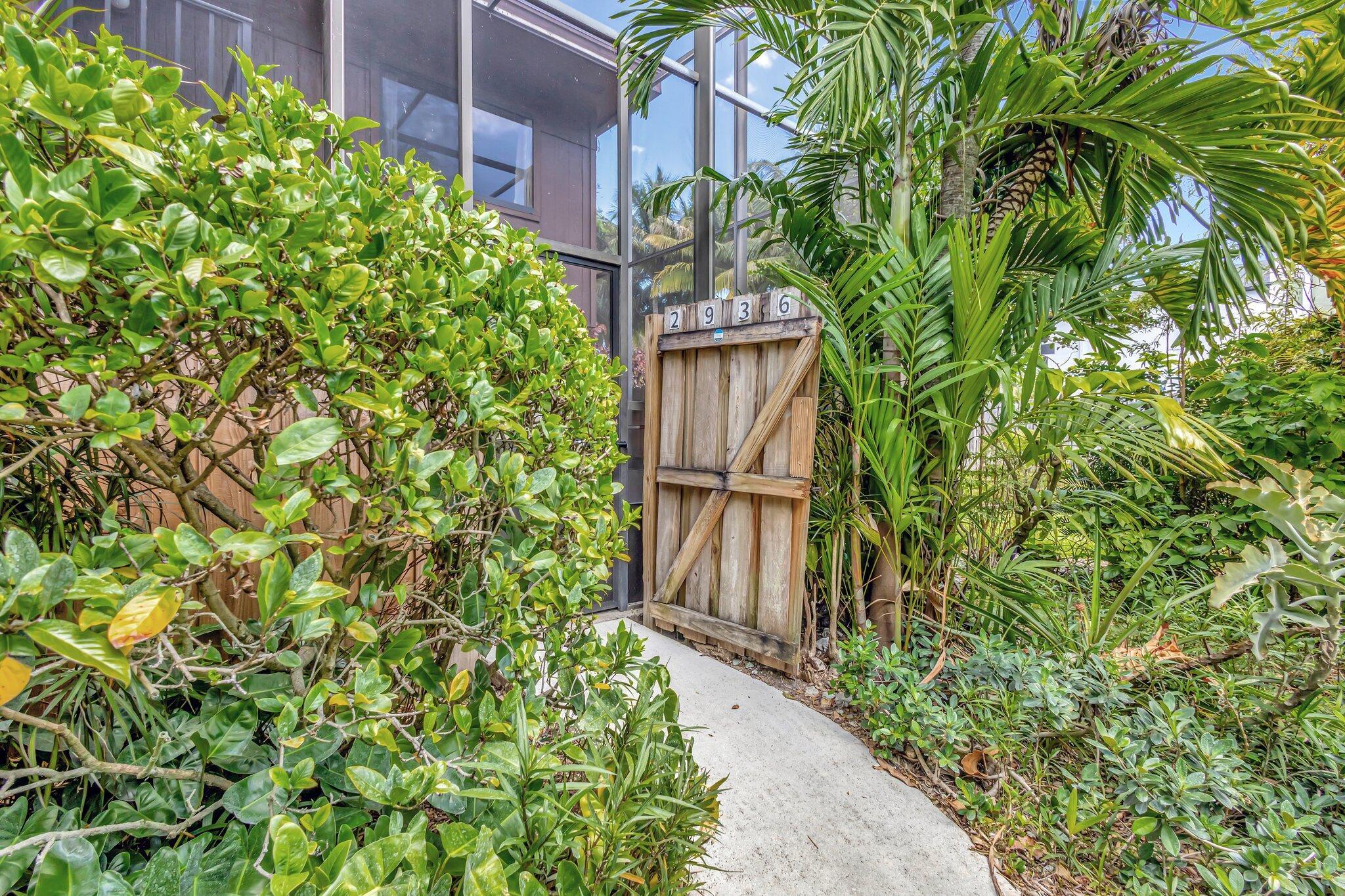 Perfect private oasis. This 3/2.5 with screened patio (screened in to the top townhouse) is beautifully landscaped. ***NEW: Laminate flooring on stairs and 2 bedrooms., kitchen countertops, stove, microwave, dishwasher (2023) and refrigerator (2024). Also new, washer and dryer (2023), all ceiling fans, toilets and ring camera. Tinted sliders for extra privacy and coolness. Come see for yourself.