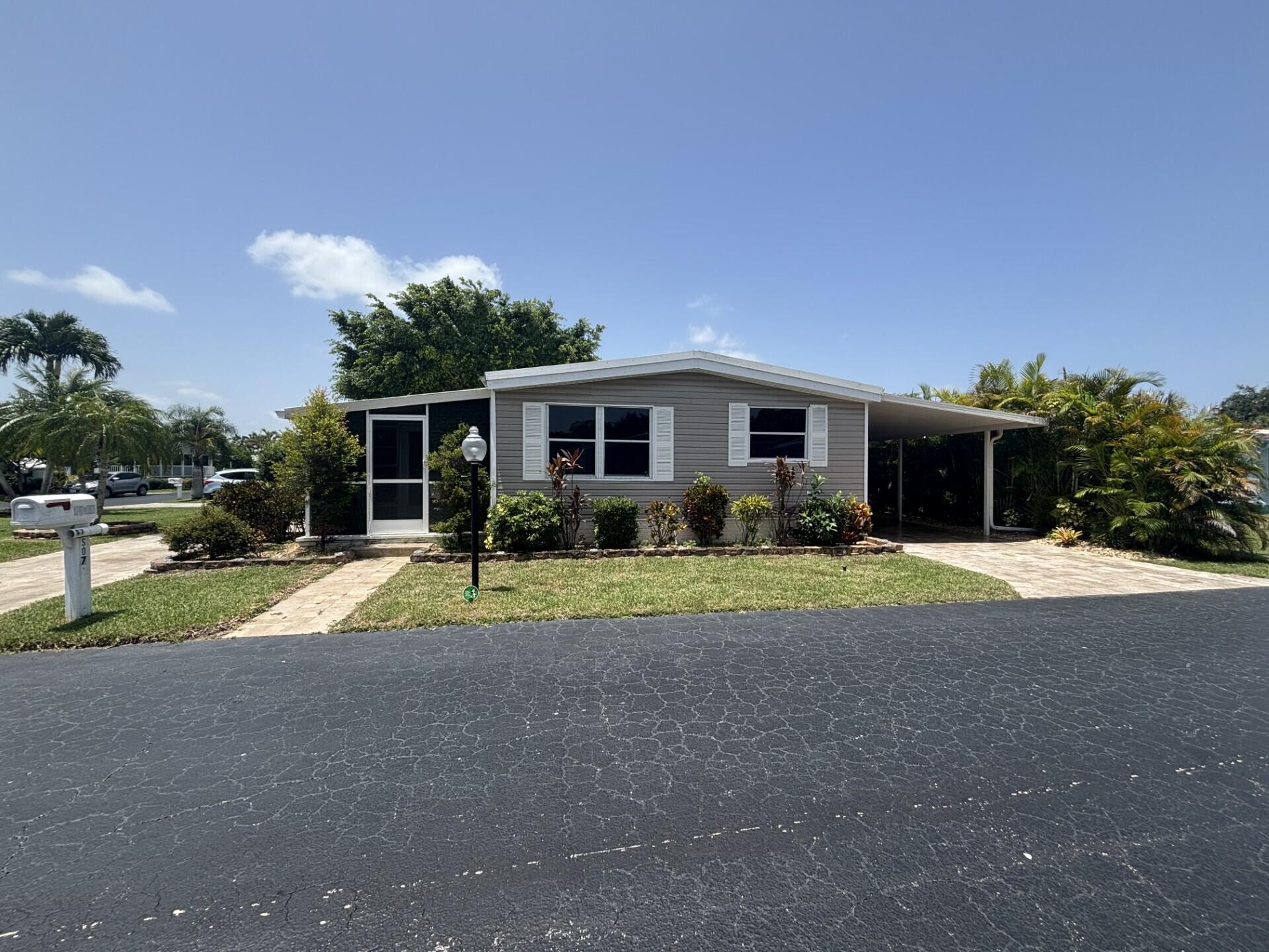 BEAUTIFUL, VERY SPACIOUS HOME WITH 3 BEDROOMS, 2 BATH'S, FLORIDA ROOM AND AN EXTRA 2 ROOMS THAT COULD BE A 4TH BEDROOM AND AN OFFICE.  LOCATED IN A 55+ COMMUNITY, ONLY A FEW MILES FROM THE DESIREBLE DEERFIELD BEACH, MAJOR AIRPORTS, HOSPITAL AND MORE.  LOT RENTAL $1,062.71 MONTHY.