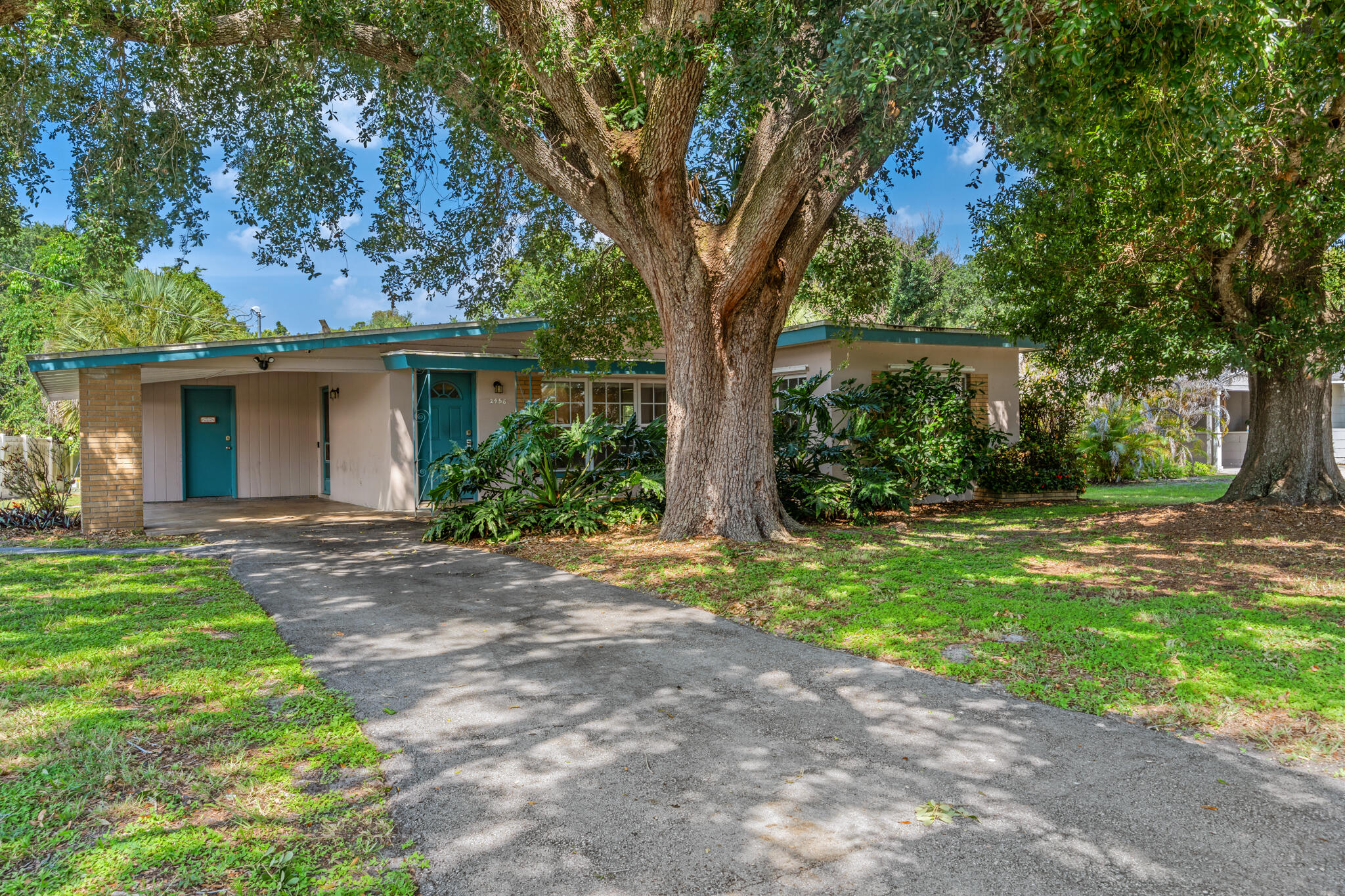 Welcome to McAnsh Park! This unique home features 3 bedrooms and 3 private bathrooms in the main house, plus a detached 1 bed, 1 bath ADU efficiency or "mother-in-law suite." It offers perfect versatility for multi-generational living or a savvy investor looking to capitalize on the rental potential. Built with solid CBS construction, the roof, plumbing, and electrical have all been updated. Includes a carport, an attached laundry room with storage, plus a utility shed or workshop. Calling all investors, house hackers, and handyman - don't miss this opportunity to give this property some TLC and unlock all its potential! Enjoy living close to downtown Vero Beach dining, shopping, and festivals, all while being just a 15-minute drive to the beach or the highway.