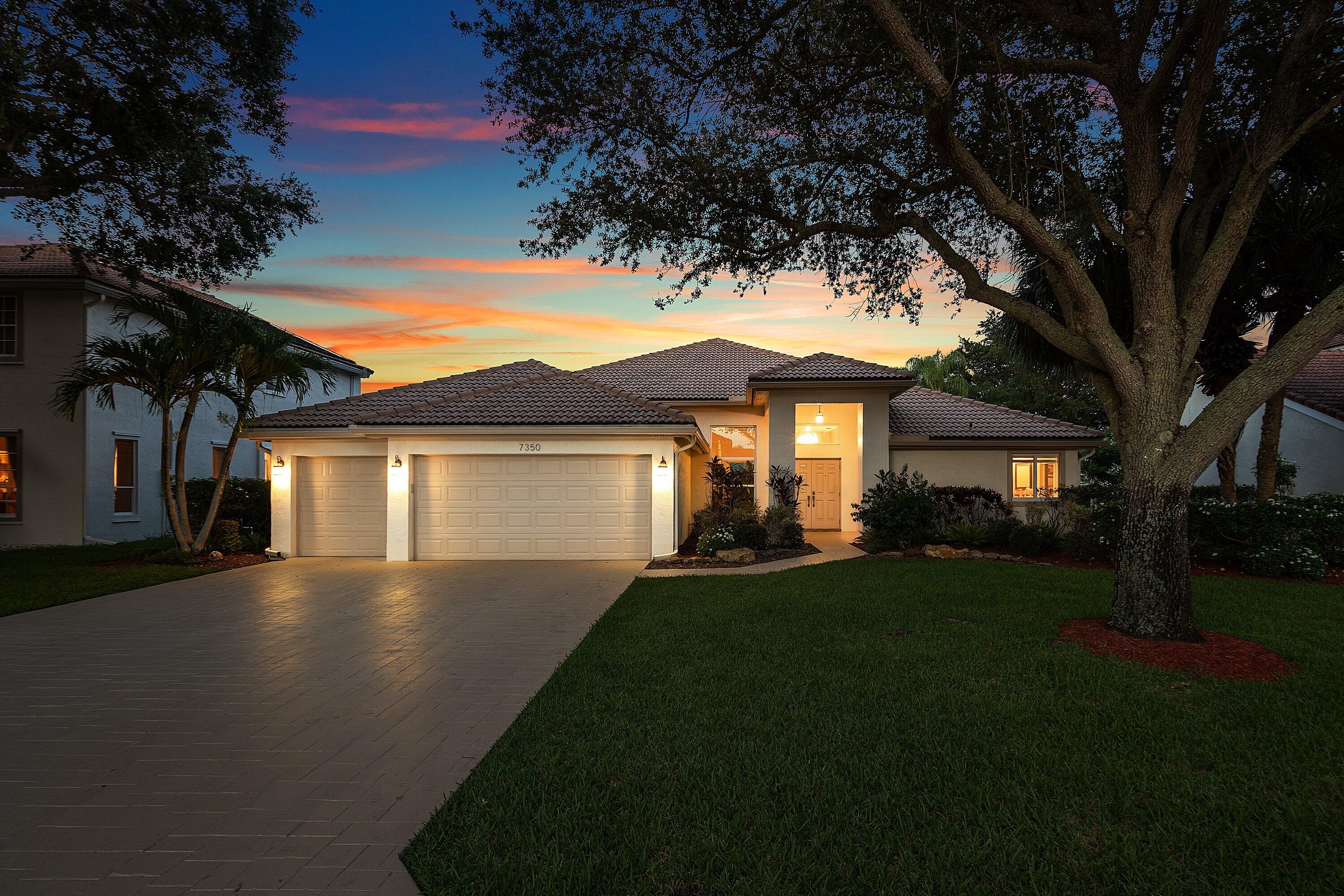 Experience the lakefront lifestyle in this beautifully appointed 4-bedroom residence with a bonus room, situated within the estate section of guard-gated Whittier Oaks. Serene, panoramic wide-lake views are thruout the entire home via expansive walls of impact glass, creating a light-filled & inviting home. The kitchen opens to the expansive family room, the perfect setting for everyday living, entertaining, & large-scale gatherings. Designed with a highly desirable triple split-bedroom floor plan, the home offers exceptional privacy. Step outside to your own private waterfront retreat featuring a sparkling pool, soothing waterfall, & breathtaking lake views. Complete hurricane-impact protection, refined finishes, & large open living areas deliver comfort, & effortless South FL. Living.