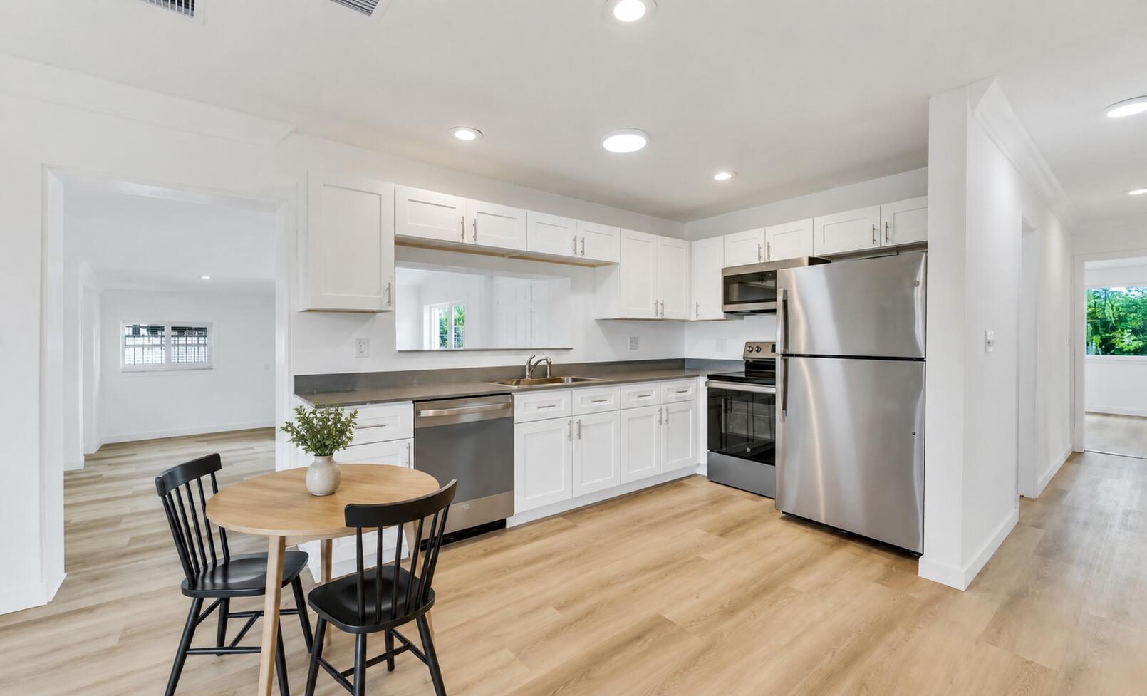 Beautifully renovated 3BD/3BA home on a corner lot east of US-1 — less than 5 minutes to the beach. Bright, open-concept layout with the kitchen flowing into dining and living areas, plus a separate rear family room for flexible everyday living. The updated kitchen features new cabinetry, countertops, and stainless steel appliances. Bathrooms have been refreshed with new tile showers and vanities. Natural light fills every room. Out back, a large patio offer space for entertaining. A detached structure with electric, tile flooring, windows, and sliding glass doors serves as a standout bonus, perfect as a home office, studio, or creative space. Ideally located in one of Deerfield Beach's most sought-after pockets, with easy access to the beach and shopping. Flexible rental terms available.