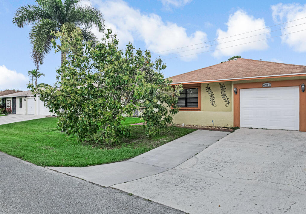 Rare 3-Bedroom Find with Ultra-Low HOA! This single-story villa in Palm Hill Villas has been expanded to include a spacious 3rd bedroom (professional garage conversion), making it one of the best values in West Palm Beach. The home features durable CBS construction, ceramic tile throughout, and a primary suite with a walk-in closet. Enjoy outdoor living on your covered patio overlooking a private backyard with fruit trees. With a remarkably low HOA of only $114/month, you get access to a community pool, tennis, and basketball courts. Perfect for families or those needing a home office!