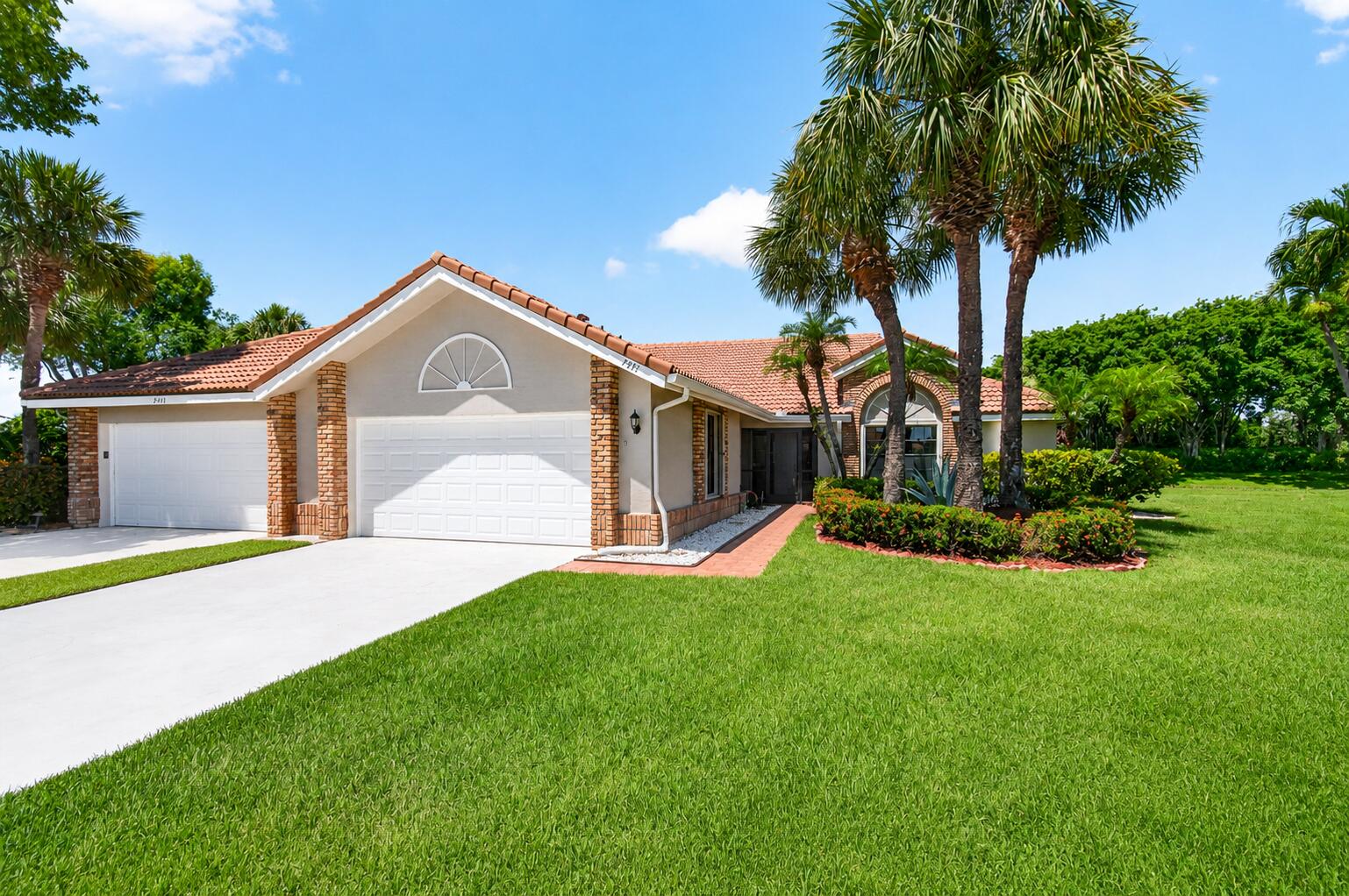 Enjoy breathtaking lake views from this beautifully maintained villa in Aberdeen Country Club. Featuring accordion shutters throughout, this home offers both comfort and peace of mind. The updated kitchen showcases modern finishes, while the renovated bathrooms add style and convenience. The spacious layout is perfect for everyday living and entertaining, with plenty of natural light and serene water views. Relax on your screened patio and enjoy the South Florida lifestyle. Aberdeen Country Club offers exceptional amenities, including championship golf, tennis, pickleball, resort-style pools, fitness center, dining, and a vibrant social calendar. Mandatory club membership required.