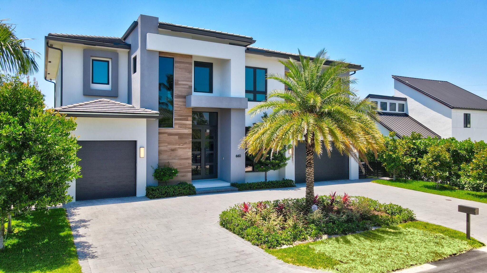 PRICED TO SELL !! OWNER PURCHASED LARGER HOME -MUST SEE!! LOCATION!! LOCATION!! LOCATION!! This Modern Estate was built by Premiere Builder, ''Elysee Homes'' You will be in Awe of this architectural masterpiece with Waterfront living unlike no other on canal going directly into the beautiful Intra Coastal (5 homes from the Pointe). Features include: 5 En-Suite Bedrooms Den/Office/Club Room 5 Full Baths 1 1/2 Bathrooms - (3) Garages, Quartz Countertops Italian Porcelain Tiles 48X48 2nd Level - Engineered Hardwood 12 Ft Ceilings 10 Ft Front Door Full House Generator Elevator Outdoor Kitchen More... WATER BOCA ESTATE
Bring your Yacht and Walk to the Beach from this south facing (in the rear) NO FIXED BRIDGES-20,000 lb boat lift.