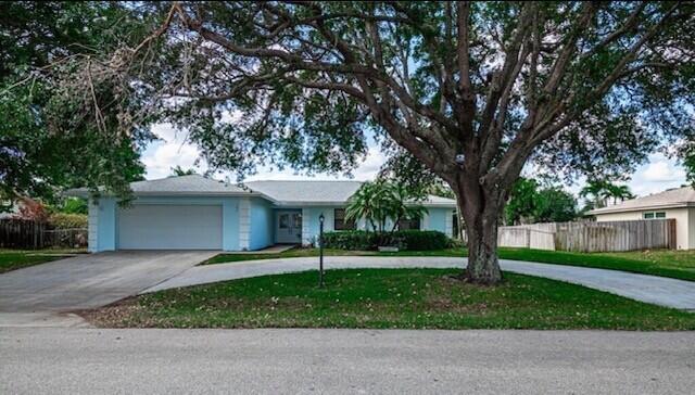 Beautifully remodeled large 4BR/2BA single family home with 2,335 sq. ft.  and a spacious 2-car garage. Remodeled in 2021, this spacious home offers a large, comfortable open floor plan with beautiful bamboo wood flooring throughout. The huge kitchen is impressive, complete with modern stainless steel appliances, lots of cabinets and plenty of storage space. Perfect for easy living and entertaining, the home also includes a breakfast/eat-in area off the kitchen in addition to a formal dining room. Large oversized closets, plantation shutters, ceiling fans, an indoor laundry room, and a screened back patio for relaxing and enjoying the outdoors. The large fenced yard offers plenty of room for kids and pets to play. Great curb appeal with mature trees and circular drive for lots of parking.