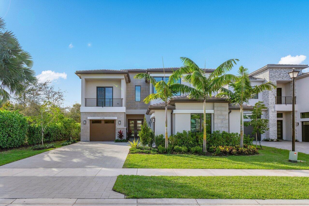 17185 Ludovica Lane, where luxury meets lifestyle in the heart of Boca Bridges - one of Boca Raton's most sought-after guard gated communities. This is a stunning 2023 built Sanibel Contemporary by GL Homes, offers 5 bedrooms, 6.5 bathrooms, and 5,170 square feet of beautifully curated living space across two elegant levels. Soaring ceilings and oversized porcelain tile floors set the tone for refined living. Private pool with serene lagoon views. A 3-car garage with a Tesla EV charger. Residents enjoy world class amenities including a 27,000 SF clubhouse, gourmet restaurant, resort style pool, tennis, pickle ball, basketball, fitness center, and playground. Close proximity from top rated schools, town center mall, and easy highway access.