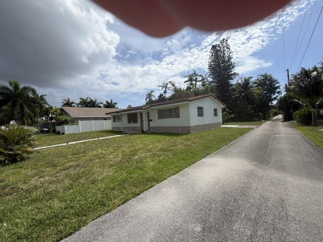 Welcome to this inviting 3-bedroom, 2-bathroom home featuring a spacious den, offering plenty of flexibility for a home office, playroom, guest space, or additional living area.  Ideally located in the heart of Dania Beach, this property provides easy access to some of South Florida's most desirable destinations. Enjoy being just minutes from the beach, nearby casinos, the Fort Lauderdale-Hollywood International Airport, and the popular Dania Pointe shopping, dining, and entertainment district.  The home offers a comfortable layout with generous living spaces and features its original windows, giving buyers the opportunity to preserve the home's character or upgrade to impact windows based on their preferences and needs.  Whether you're looking for a primary residence, vacation home, or in