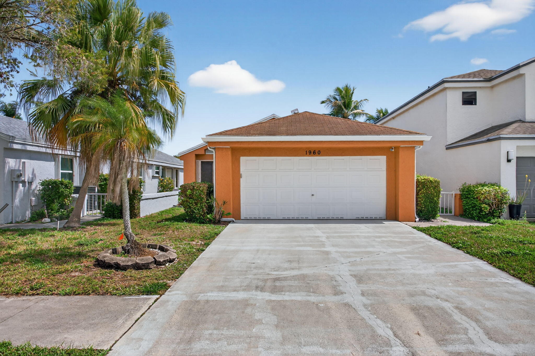 Welcome to this beautifully maintained 3-bedroom, 2-bath home with a 2-car garage, located in the highly sought-after man-gated community of Centura Parc in Coconut Creek. This home features a bright and open layout with soaring high ceilings and serene lake views, creating a spacious and inviting atmosphere. Skylights in the dining room and primary bathroom bring in abundant natural light, enhancing the warmth and comfort of the living space. Residents of Centura Parc enjoy access to resort-style amenities, including three swimming pools, a fully equipped fitness center, jacuzzi, clubhouse, tennis courts, and racquetball courts, all within a secure 24-hour manned community.