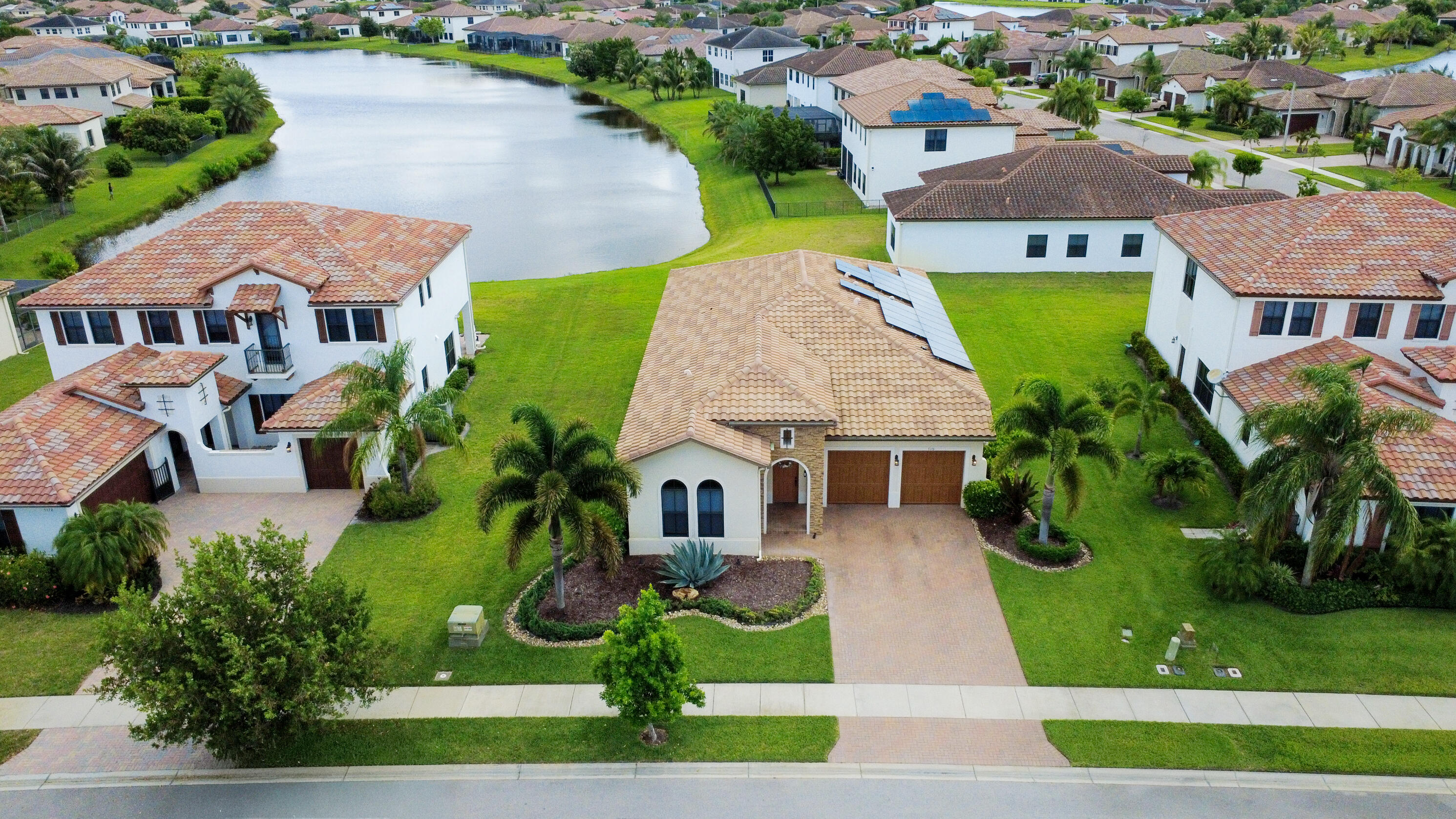 Experience resort-style living in one of Ave Maria's most desirable communities featuring a stunning clubhouse, expansive green spaces, and incredible amenities just moments from shopping, dining, parks, and schools. Situated on a breathtaking lakefront lot, this beautifully upgraded 4-bedroom, 3-bath home offers an open split-bedroom floor plan with soaring 12-foot ceilings and stunning water views. Features include luxury vinyl flooring, built-in closet systems, impact windows and doors, surround sound speakers, whole-home water filtration/softener system, solar panels, and a spacious layout perfect for entertaining.    .