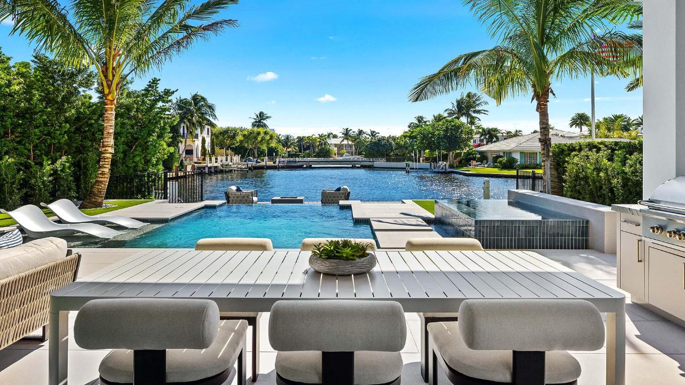 Brand-new contemporary waterfront estate by Varga Homes with architecture by RWB Linares and interiors by Ava Gray. Premier Delray location with direct boating access and close to the beach and Atlantic Avenue. Features soaring ceilings, expansive glass, double-island chef's kitchen, hidden pantry, and seamless indoor-outdoor flow. Resort-style backyard with infinity pool, spa, summer kitchen, cabana bath, and outdoor shower. Upstairs primary suite with panoramic water views and custom closet. Includes executive office, club room, custom dock, impact construction, whole house generator, and high elevation. A rare opportunity to own a brand-new move-in ready waterfront estate in East Delray's most sought-after neighborhood. FEATURES

Inside, exquisite designer finishes and meticulous craftsmanship define every detail. The open concept main living area showcases soaring ceilings, expansive glass doors, and a stunning double island gourmet kitchen featuring premium appliances and a large hidden pantry. The space flows effortlessly to a resort style outdoor living area complete with an infinity edge pool, spa, summer kitchen, cabana bath, and an outdoor shower. The southern exposure ensures all day sunlight and serene water views.
 
Upstairs, the spectacular primary suite captures endless water vistas through oversized impact sliders and features a spa inspired bath and an oversized custom closet. Two additional guest suites complete the second floor, offering privacy and elegance for family or visitors. The first floor includes an executive office and a spacious club room that can easily serve as a ground floor VIP suite with a full bath and direct pool access.
 
With 39 feet of prime waterfrontage and a custom dock, this home is ideal for boating enthusiasts. Additional highlights include an oversized garage, entry powder room, full hurricane impact construction for peace of mind, a whole house generator, and one of the highest elevations in the beach area for safety, value, and long term confidence.
 
Every element of this property embodies modern luxury, effortless style, and the very best of coastal living. 1142 Harbor Drive stands as the only brand new, move in ready waterfront estate in East Delray Beach, a truly one of a kind opportunity for the discerning buyer.