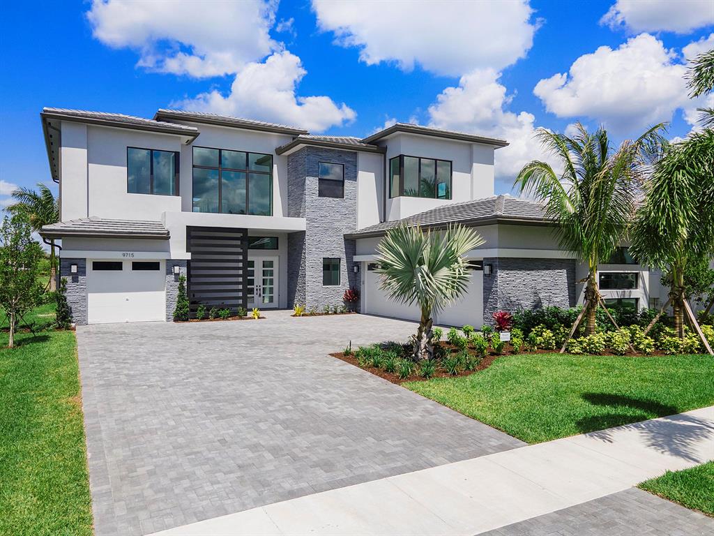 Brand new 2022 Palermo Contemporary spanning over 8,000 square feet in total on an oversized (12,400 sq foot) lakefront premium lot in the highly sought after community of Boca Bridges.  This dream home offers the most ideal layout with plenty of living and entertaining space featuring 5 bedrooms, club room (opt. 6th bedroom), media room (opt. 7th BR), loft, TWO laundry rooms and a 4 car garage.  

Finished with thoughtful details including premium tile flooring throughout the downstairs and wide plank white oak wood flooring upstairs you will fall in love with all that this home has to offer.  The upgraded kitchen boasts a double island, wolf and subzero appliances, a coffee/breakfast bar and a walk in pantry.  Enjoy the lake view from your kitchen, breakfast area and family room through panoramic sliding doors leading out to a covered terrace.  In the club room (opt. 6th bedroom) you will find a large space with sliding doors to the backyard for a true indoor/outdoor entertaining experience.  In addition to the formal living and dining areas the spacious downstairs also includes a large wet bar, en-suite bedroom/bathroom, full size laundry room, cabana bathroom, mud room drop zone, storage and an additional half bath.

Off the two story entryway you will find a beautiful wood staircase leading upstairs to a grand open loft area which would be a perfect office, play area or flex space depending on your needs. The immense primary bedroom includes double built-in walk-in closets and an en-suite bathroom retreat with Carrara marble countertops, double vanities, separate bathtub and shower. The media room (opt 7th bedroom), three additional bedrooms (two of them en-suite) and second laundry room with full size washer, dryer and sink complete the second floor. 

This luxurious contemporary estate sits an immense lot overlooking stunning views of the lake.  The saltwater pool/spa is in progress with the renderings shown in the listing photos.  There is still time for the buyer to customize the pool design and features. GL homes offers a new home warranty that is transferable to new owner.  Do not miss this opportunity to make this home yours!

Boca Bridges is luxury living at its finest complete with a 27,000 square foot clubhouse set on over 7 acres.  Residents have access to world class resort style amenities including a beach entry pool, kids splash pad, gourmet restaurant, indoor and outdoor basketball courts, game room, playground, tennis, pickle ball and so much more.  HOA includes two 24 hour manned guard gates, 24 hour roving security, home alarm monitoring, lawn care, common area maintenance and access to all of the clubhouse amenities and activities.