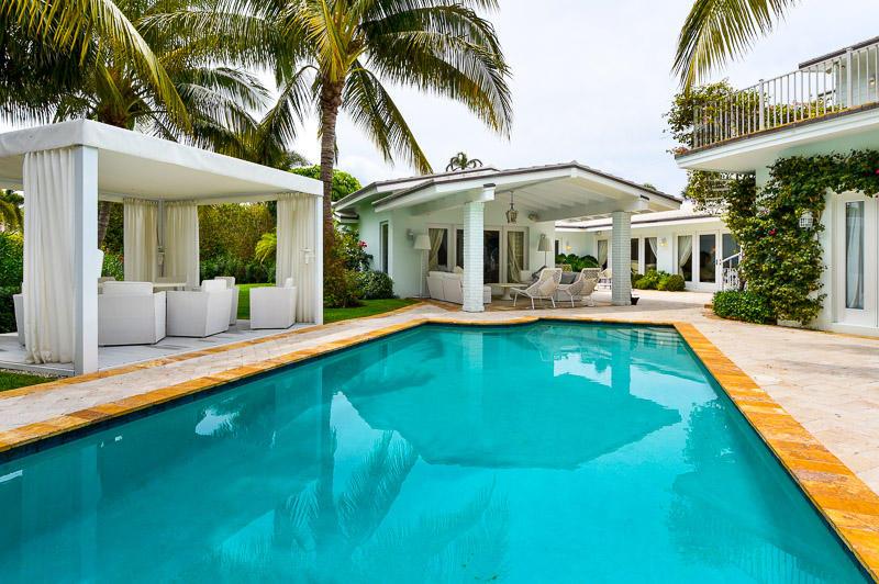Fabulous 5BRD/5.5BTH North end beach house, designed and renovated by Smith and Moore Architectural firm. Features include marble floors, granite counter-top, top-of-the line appliances, lovely patio/pool area, lush landscaped garden, impact windows, 2-car garage and more. Southern exposure. Serene setting. Situated on a large, approx. ~ 14,000 SF lot. High Elevation. Beach Access.