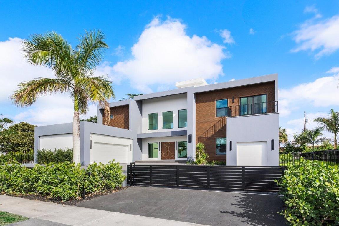 Your new lifestyle will exceed your expectations in this eloquently designed contemporary beach estate. Its offerings include; a grand gated entry with plenty of parking for friends and family, and 3 garage spaces with plenty of height to add lifts for more luxury car space. Upon entry of the oversized double custom doors you will be greeted with 25 foot ceilings boasting ample natural light, and highlighted by custom floating staircase and modern yet elegant fixtures. The north side of the estate features a meticulously designed custom kitchen with 12 foot ceilings, highest quality appliances and fixtures, thoughtfully designed to provide you with ease for entertainment and indoor outdoor Florida living. The south end of the main level includes an inviting in-law suite with oversized ensuite and walk-in closet, an additional bedroom ensuite which could convert easily to an executive office. Prior to arriving at the air conditioned 1 car garage  with Gym!conveniently located 1st floor laundry facility. As you ascend the floating staircase onto the second level you will be enamored by the 11 foot second floor ceilings and brilliant layout which provides the owner a master wing of their dreams, including a morning kitchen and large terrace along with a well appointed ensuite. Crossing the open walkway to the south end of the second story you will appreciate the natural light once again! The open loft and wet bar makes for a perfect game room or home office. There are 3 additional bedrooms, 2 bathrooms and a second laundry room to enhance your luxury living experience. Returning to the custom staircase to access your roof top terrace will undoubtably be a staple in your daily routine. The Terrace sits more than 50 feet above sea level and offers amazing sunrise views over the ocean as well as gorgeous sunsets framing the preserve. Additional outdoor amenities to fulfill your lavish lifestyle include a custom pool and spa, putting green, outdoor kitchen, and cabana bath. Although you may not want to leave, your convenient access to one of the most amazing beaches in the country is less than a 5 minute walk away. Your Juno Beach Estate awaits!