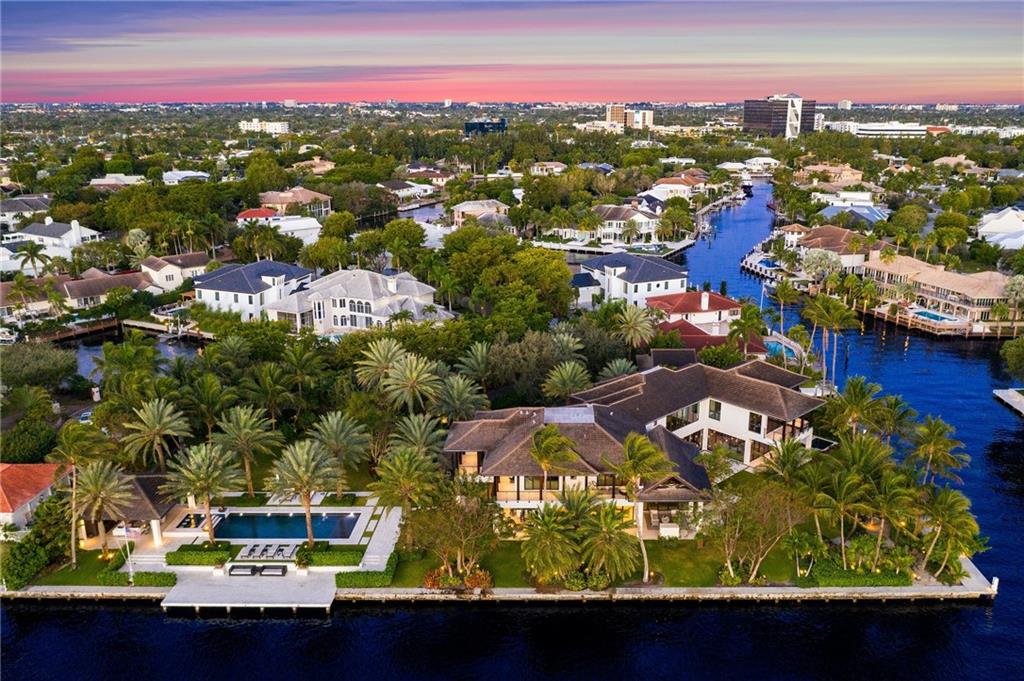 Magnificent Balinese inspired contemporary Point Lot Estate! Premier 49,023 SF lot w/ 800' of WF including 505' on the Intracoastal point, 165' of protected dockage & 65'x20' boat slip w/lift. Home features Calacatta Gold kitchen countertops, Limestone/wood floors, Crestron Smart Home system & temp controlled wine cellar. Oversized master w/spa bathroom. Truly set up for entertaining w/media room, large family room off eat-in kitchen & stacking glass doors that seamlessly blend the indoor & outdoor spaces. Vast backyard w/numerous lounging areas, 50' salt-water lap pool, putting green & even your own private beach overlooking the Intracoastal! Located in Bay Colony, the only 24/7 armed & gated yachting community in FTL & minutes to Pine Crest, one of the nation's premier private schools.