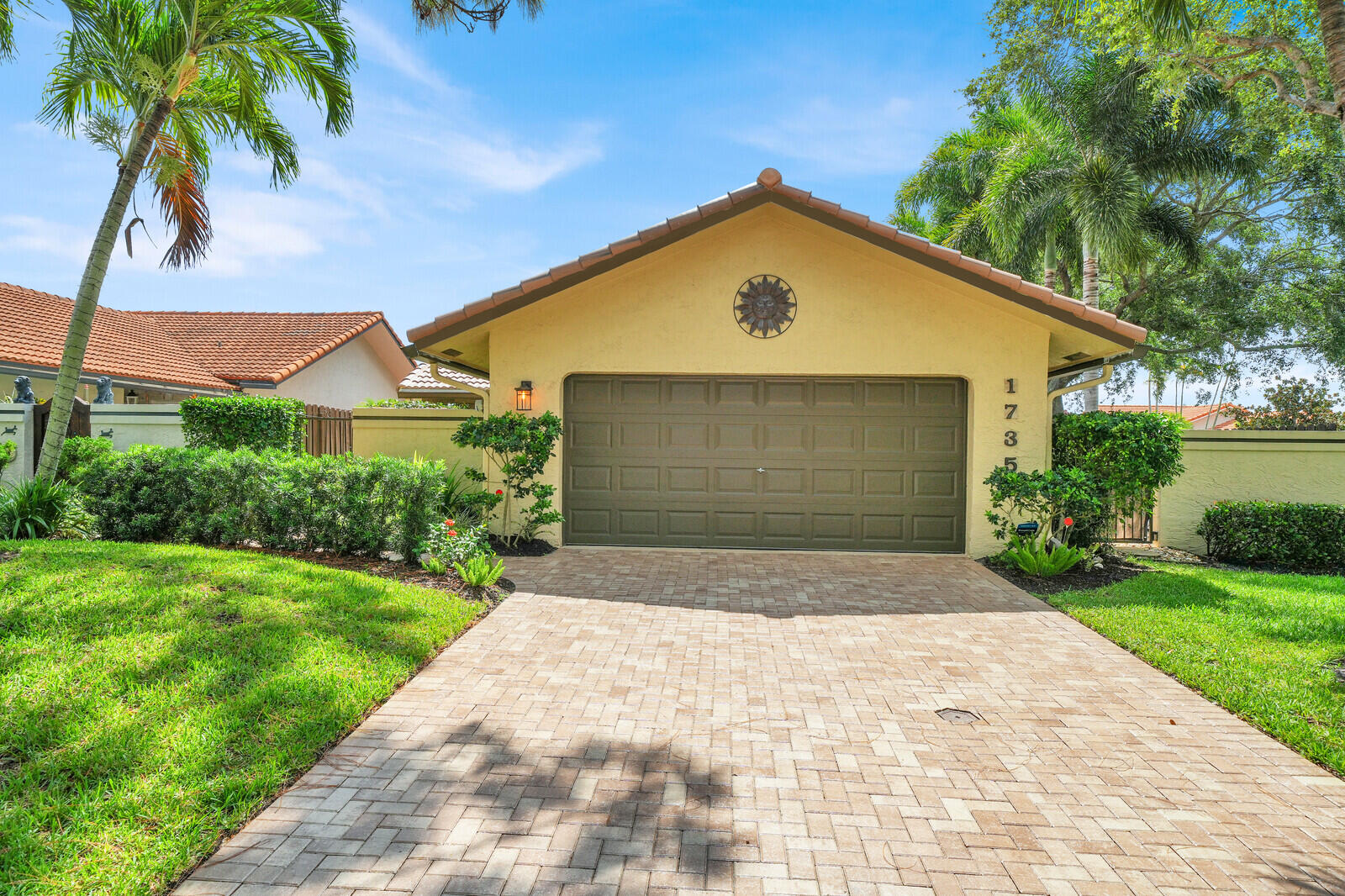 Over $120,000 in Recent Upgrades! This impeccably maintained home is truly move-in ready. Major improvements include a new roof, full-home generator, all impact windows, sliders, front door, and garage door, 2026 programmable LiftMaster garage door opener, and beautiful driveway pavers.  Step outside and unwind in your private 3-person hot tub, creating the perfect space to relax after a day at the beach or entertaining family and friends.  Located in a highly desirable guard-gated community, residents enjoy exceptional amenities including two pools, tennis courts, pickleball, basketball courts, and scenic walking paths. Just minutes from vibrant Atlantic Ave with dining, shopping and the famous beaches.