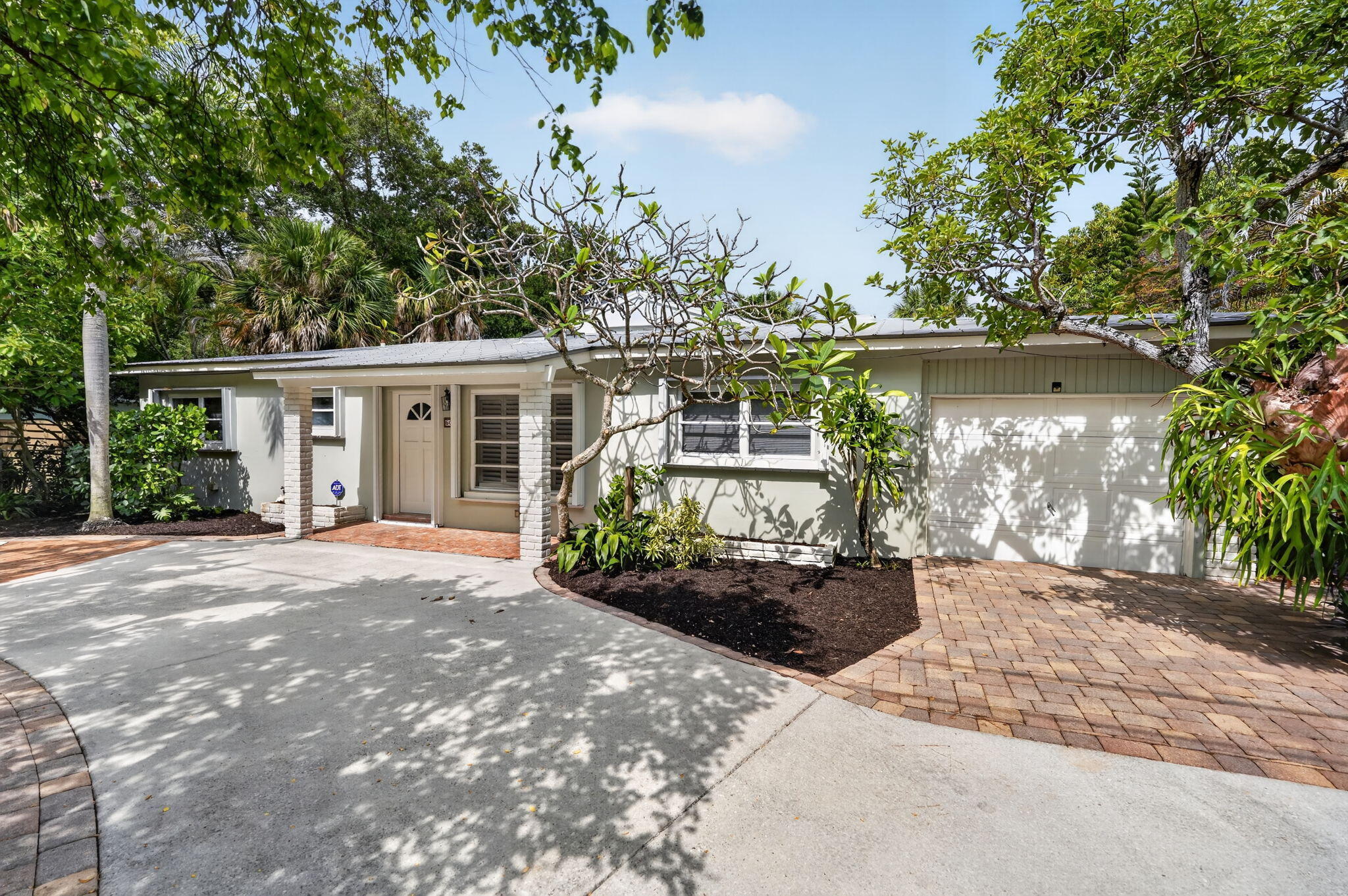 Welcome to Old Jupiter, one of the area's most charming and established coastal neighborhoods. This thoughtfully updated four-bedroom, two-bath single-family residence offers 1,724 square feet of comfortable single-level living just minutes from the Jupiter Inlet, beaches, waterfront dining, marinas, and local favorites. Recent improvements include a beautifully updated kitchen with quartz countertops, fresh interior paint, new ceiling fans, and enhanced landscaping. Vaulted ceilings and abundant natural light create a bright and inviting atmosphere, while French doors open to private outdoor living spaces surrounded by mature tropical foliage. Additional features include a one-car garage, impact glass, storm protection, metal roof, and ample parking. Annual Lease. Pets considered.