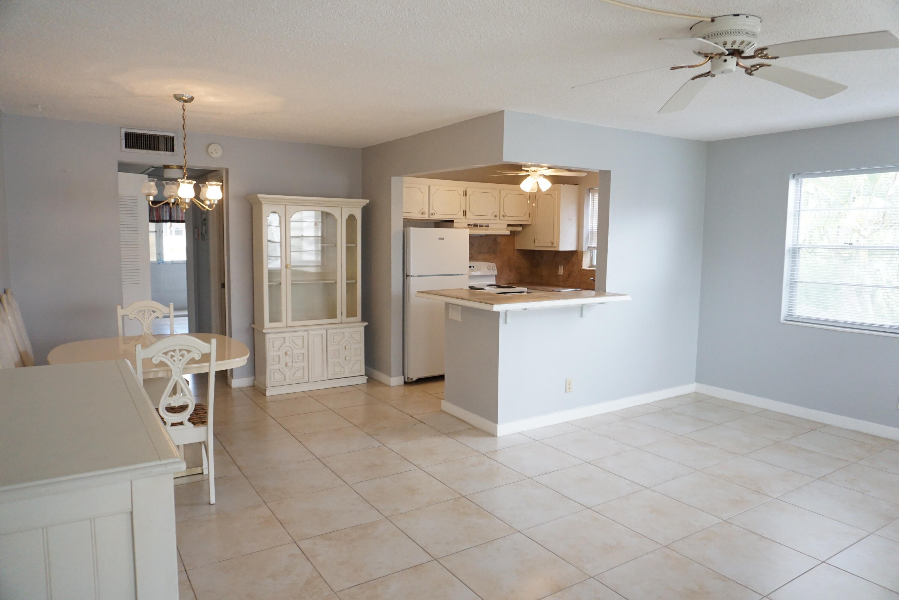 CENTURY VILLAGE IS A RESORT STYLE COMMUNITY FOR ADULTS 55+ ONLY... 1 BED 1.5 BATH CONDO... 2ND FLOOR END UNIT WITH CENTRAL AC. FRESHLY REDONE, UPDATED. PLENTY OF ROOM TO ENTERTAIN IN WITH LARGE LIVING ROOM AND DINING AREA. BEDROOM HAS TONS OF CLOSET SPACE. THE FURNITURE CAN BE REMOVED. CLOSE TO LAUNDRY ROOM. VERY CLOSE TO THE OKEECHOBEE BLVD GATE. THE MAIN CLUBHOUSE HAS A THEATER WITH MOVIES AND SHOWS, BILLIARDS ROOM, FITNESS ROOM, AEROBICS, YOGA, TENNIS, CRAFTS AND CARD ROOMS, WOODSHOP COURTESY BUSES FOR ERRANDS AND SHOPPING.