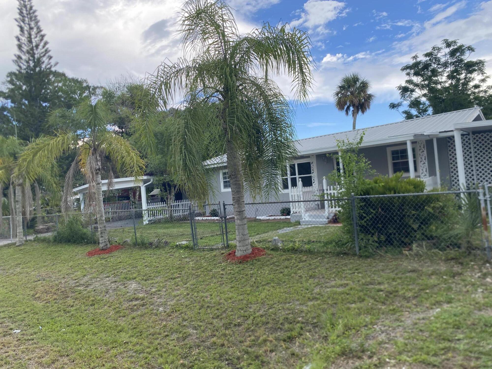 Welcome to this well-maintained 4-bedroom, 3-bathroom home offering 1,945 square feet of comfortable living space in a desirable Okeechobee location. Designed with both functionality and comfort in mind, this spacious residence provides plenty of room for families, guests, or those who simply enjoy extra space.Inside, you'll find a thoughtfully designed floor plan with generous living areas, comfortable bedrooms, and three full bathrooms to accommodate busy households. Natural light fills the home, creating a warm and inviting atmosphere throughout.One of the property's standout features is its two covered patios—one on each side of the home—providing multiple outdoor spaces for relaxing, entertaining, enjoying morning coffee, or hosting family gatherings.