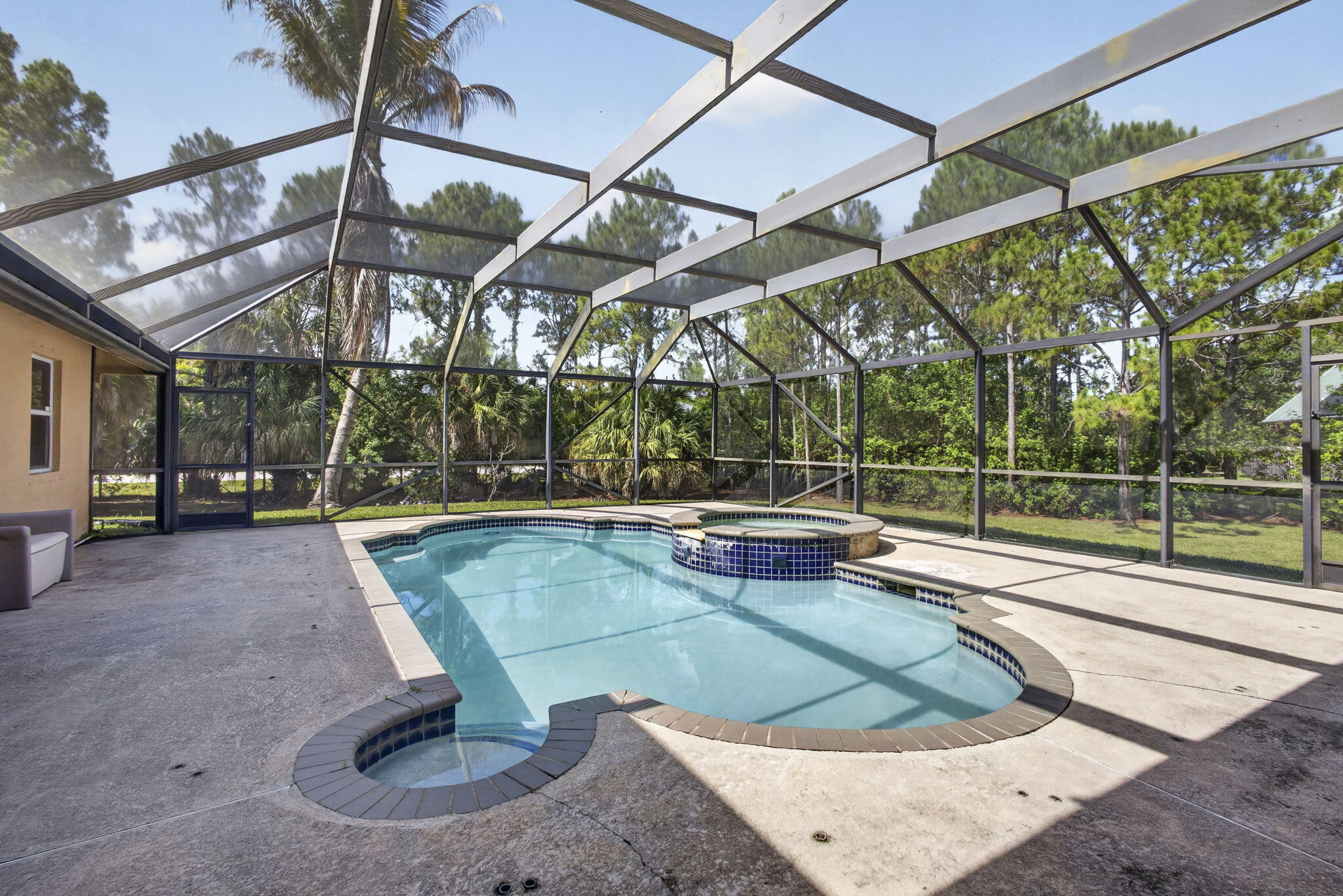 Private Pool Home on Over an Acre of Land | Guest Suite | No HOA | Room for RVs & Boats  Welcome to your private Loxahatchee retreat! Situated on over an acre of land, on a quiet private street, this pool home offers the perfect blend of space, privacy, and convenience. Enjoy a screened-in pool, expansive outdoor living areas, and plenty of room for RVs, boats, trailers, and all your toys with no HOA restrictions. The guest suite features a private entrance, making it ideal for multi-generational living, extended guests or additional income. Experience the sought-after Loxahatchee lifestyle while remaining just minutes from shopping, dining, schools, and everyday conveniences. A rare opportunity to enjoy country living without sacrificing modern amenities.