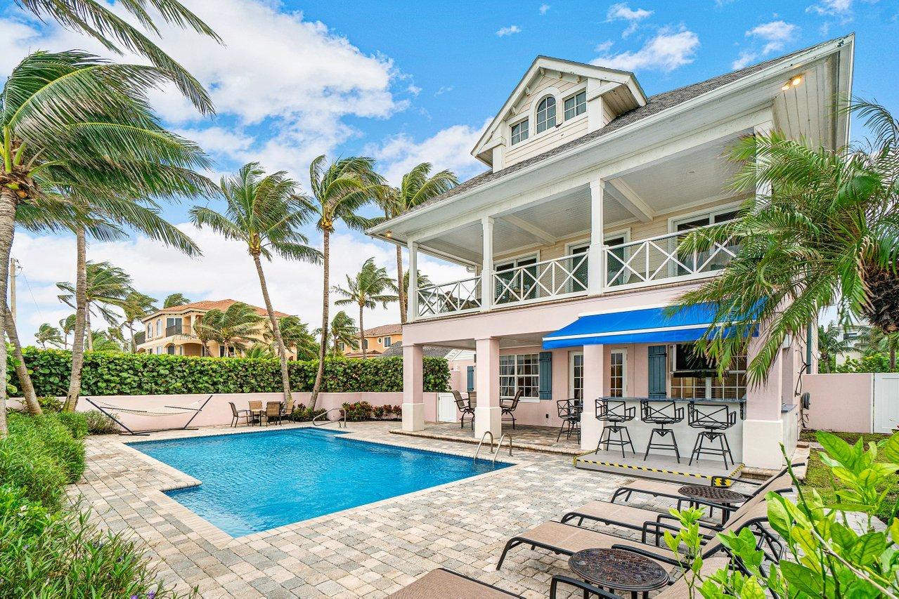 For those who are seeking the ultimate in location, luxury and living: Welcome to the Grand Estate of 226 South Ocean. Situated directly across from the Atlantic Ocean and in the heart of Delray Beach, this magnificent Historic Compound exudes sophistication, casual elegance and charm. Totaling 7,554 square feet with 9 bedrooms and 7.5 bathrooms, this family compound is perfectly fit to suit those looking for privacy and space. Comprised of a recently updated 5/4.5 Main Residence, a fully renovated 3/2 Guest Cottage, and a separate 1/1 staff quarters convertible to an enclosed garage, 226 S. Ocean offers 180 degrees of unobstructed panoramic ocean views on just under half an acre of meticulously maintained grounds with tropical setting, making this offering exceptionally rare and unique. The Main Residence:
Built in 2002, the Main Residence totals 5,292 square feet of the finest craftsmanship and detail. 5 bedrooms and 4.5 baths are perfectly placed within its 2.5 levels (Master Bedroom and 2 guest bedrooms located on ground floor, 1 guest bedrooms on floor two/main floor and a charming oceanfront bedroom via spiral staircase located on top floor). Casually elegant indoor and outdoor living areas provide endless tranquil Atlantic Ocean views; impact glass windows and sliders allow an abundance of natural light to shimmer the gleaming oak floors throughout; architecturally designed grand and spiral staircases provide an artistic touch; and the state-of-the-art chef's kitchen and brand-new outdoor summer kitchen is practically designed with entertaining in mind. Relax around your wood burning fireplace, bask in the sun adjacent to the beach in your large private patio area with summer kitchen and heated pool or enjoy a picnic on your sprawling enclosed lawn just steps to the ocean. Rounding out the many amenities of 226 S. Ocean is the ability to conveniently and comfortably park up to 8 vehicles in your private driveway. 

The Guest Cottage:
Originally built in 1935 and impeccably renovated in 2019, the Guest Cottage at 226 S. Ocean is both distinct and refined. Detached from the Main Residence with 3 private entrances, this home totals 1,618 square feet with 3 oversized bedrooms and 2 exquisite baths. The top-of-the-line total renovation was completed with no detail spared. White soap stone countertops, grey porcelain driftwood flooring, stainless steel appliances, an abundance of impact glass windows facing the Atlantic Ocean, and the perfect touch of the original Pecky Cypress ceilings whitewashed to perfection provide the ultimate in light and bright beachfront living with a tropical vibe.

The Grounds:
226 South Ocean is comprised of .44 acres of meticulously maintained tropical landscaping on the corner of A1A and Nassau Street in the heart of Delray Beach. With 116' of oceanfrontage, this beachfront paradise features a fenced yard with large green space, a recently refinished heated pool, and a newly installed (October 2020) top-of-the-line Summer Kitchen outfitted with a Samsung Special Edition Outdoor 55" TV, Fire Magic BBQ Grill + Rotisserie with double side burners, Big Green Egg Smoker, Refrigerator, Sink, 1.5" Blue Macauba Marble Countertops, electrical outlets with USB and USB-C charging ports, retractable awning, and bar seating for 6, providing a true tropical oasis.

Location:
Fronting Delray's world-class beach, 226 S. Ocean's quiet setting sits just steps to the sand and a short two-block walk to the vibrant Atlantic Avenue where you will find an endless array of famed restaurants and boutiques.