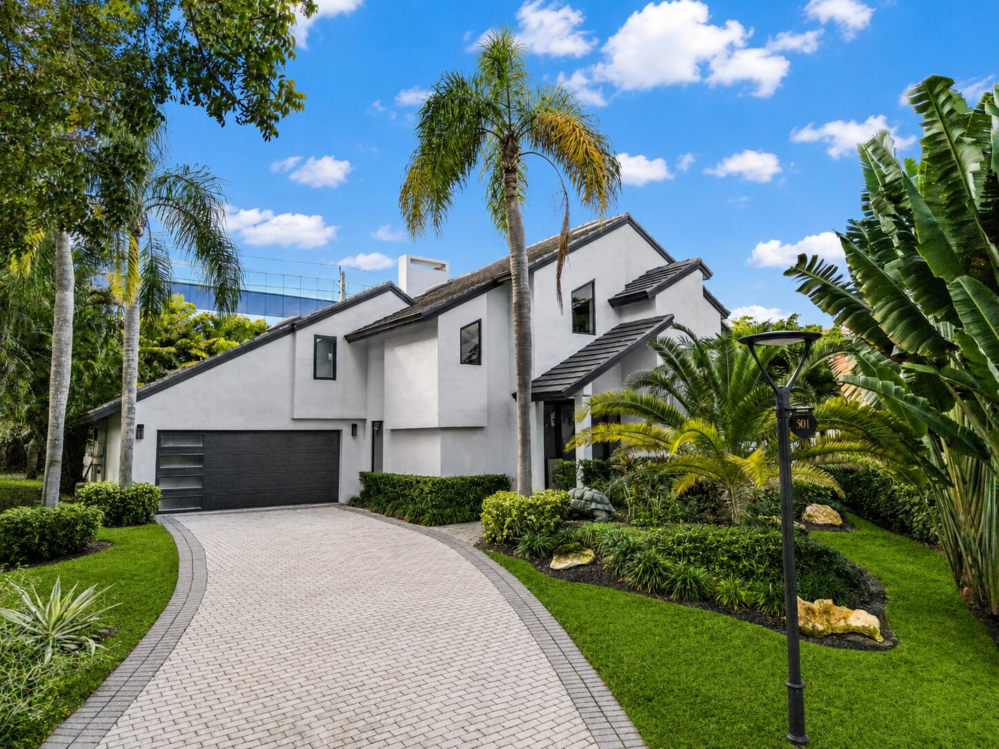 All new 2024 decorator designed work of art! This oversized-lot estate in Boca Raton's exclusive Sanctuary offers split bedroom plan, 4 bedrooms (2 first floor bedrooms), 5 full baths, & 2 half baths. Features include soaring ceilings, quartz countertops, custom cabinetry kitchen, high-end appliances, 2 master baths, bespoke fireplace, abundant storage. Updates include a new roof + Impact glass, new flooring, new en suite bathrooms in all rooms, 3 new AC units, & 2 water heaters. Enjoy a resort-style pool, covered loggia, pool bath, & outdoor shower, perfect for entertaining. The Sanctuary provides 24/7 armed security with land & water patrols, a private marina, pickle, b-ball, tennis courts, and a prime East location walk to beach, The Boca Raton Club, shopping, dining,& private airport!